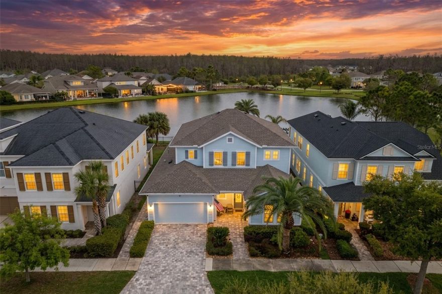 Former model homes rarely come available in Asturia, and this Mendocino floor plan is a perfect example of why they’re so sought after. Loaded with extensive builder upgrades and positioned with beautiful pond views, this home combines thoughtful design, standout architectural details, and indoor-outdoor living that makes the most of its setting.

Just inside the entry, you’ll find a bedroom and full bathroom tucked to the right, creating an ideal guest suite or private space for visitors. Continuing through the home, there is also a flexible office or workspace area before the layout opens into the heart of the home.

The main living area is where this floor plan really shines. The kitchen, dining, and living spaces flow together into one expansive area designed for both everyday living and entertaining. The dining space immediately stands out with a dramatic 2 story ceiling, filling the room with natural light and giving the entire space a grand feel. The living room features a stone accent wall and looks directly out to the pool and pond beyond.

The kitchen is a dream with custom cabinetry, under cabinet lighting, built-in appliances, a gas cooktop, and a large island that anchors the space and provides plenty of room for gathering.

Step outside to a backyard designed for relaxing and entertaining. The pool area features a spool that can operate as both a pool and spa, complete with water features, paver decking, and an outdoor kitchen. From here you’ll enjoy peaceful views overlooking one of Asturia’s main ponds.

Back inside, the primary suite is conveniently located on the first floor just off the living area. It continues the home’s upscale feel with coffered ceilings, pond views, and a spacious en suite bathroom featuring a large walk-in shower, double vanities, and a walk-in closet.

Upstairs, the layout offers two additional bedrooms connected by a versatile flex space that works well as a media room, play area, or secondary living space. A full bathroom serves this level, and there is also a finished walk-in attic area that provides excellent additional storage.

Located in the highly desirable Asturia community in Odessa, this home is within a short walk to the resort style amenities. These include a clubhouse, fitness center, resort pool, dog park, playground, and miles of scenic walking trails. With convenient access to the Suncoast Parkway, SR 54 shopping and dining, and top-rated schools, Asturia continues to be one of the most sought-after neighborhoods in the Tampa Bay area.