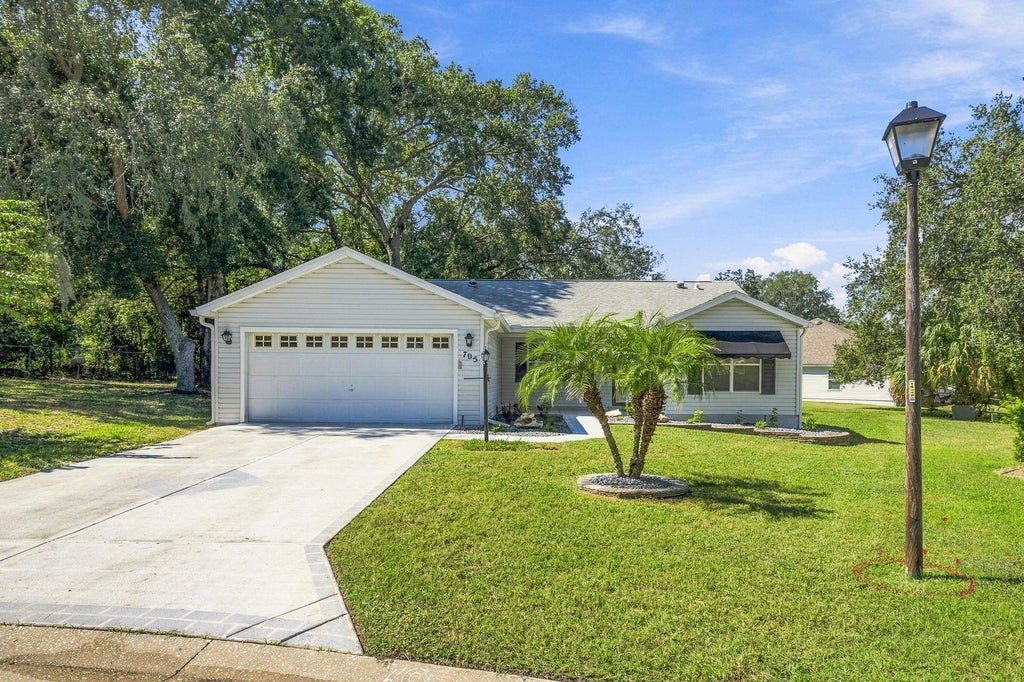 Photo of 705 Murray Lane, Lady Lake, FL 32159 (MLS # OM733371)