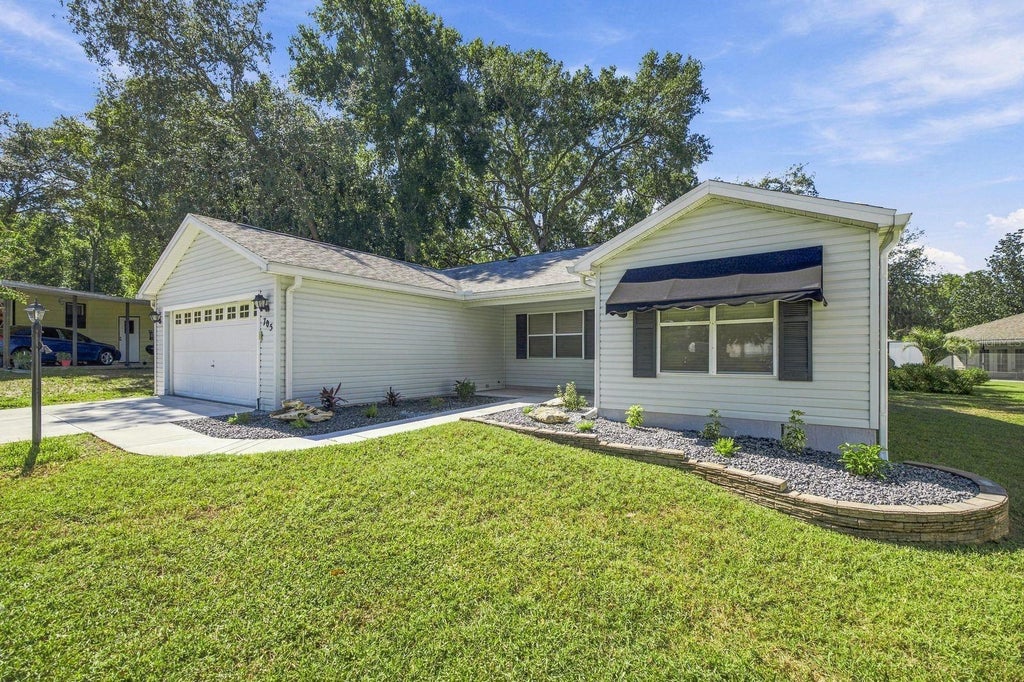 Photo of 705 Murray Lane, Lady Lake, FL 32159 (MLS # OM733371)