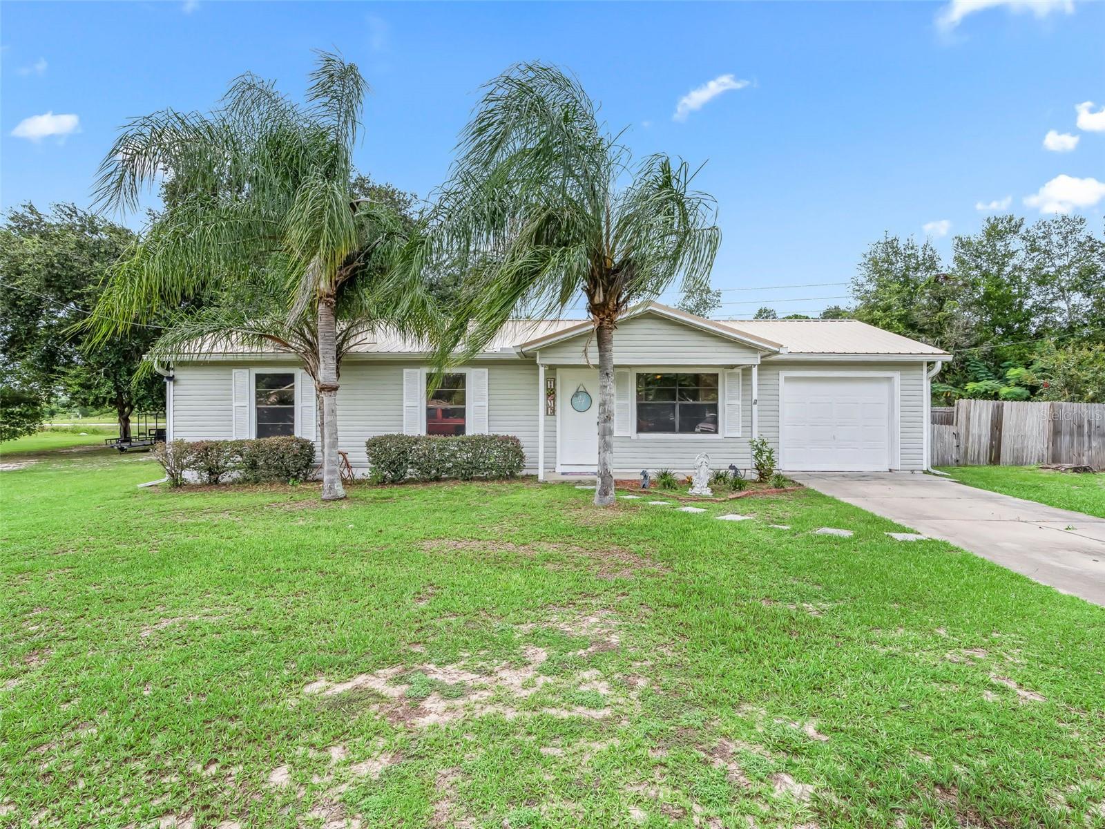 Welcome to this beautifully maintained 3-bedroom, 2-bathroom ranch-style home nestled in a quiet cul-de-sac in the desirable Silver Springs Shores community, just off Baseline Road. This home offers a fantastic blend of functionality, comfort, and outdoor enjoyment—perfect for families, hobbyists, or anyone seeking extra space.
Key Features:
• Converted Garage Bonus Room: Originally a single-car garage, now transformed into a versatile Florida Room/den/office—ideal for remote work or relaxation.
• Galley Kitchen: Well-designed kitchen with nearly new SS appliances (approx. 2-year-old), ample cabinetry, and a cozy eat-in area.
• Open Living & Dining Combo: Great flow for entertaining or everyday living.
• Comfortable Bedrooms: All bedrooms feature carpeted floors. The primary suite offers two closets and an en-suite bathroom with a glass-door shower stall.
• Guest Bath: Tub/shower combo and tile flooring in both bathrooms.
Outdoor Oasis:
• Step outside through sliding glass doors to your private paradise featuring a wooden deck, gazebo, and fully fenced backyard—perfect for gatherings or quiet mornings.
• Massive 20' x 21' detached workshop/garage with electric and RV outlet, 8' wide access door, and anchored construction for added stability. Great for storage, hobbies, or small business use.
Additional Highlights:
• Situated on a spacious .35-acre lot in a peaceful cul-de-sac.
• Metal roof installed over existing roof per spec 4/12 pitch (FL 4595.17).
• Septic tank pumped END of 2023
• Water heater was replaced approx. 5 years ago.
• Wooden privacy fence around entire backyard.
• Indoor utility room located off the kitchen
This home offers both indoor comfort and outdoor functionality with an unbeatable location near shopping, schools, and recreation. Whether you're looking for a place to call home or a property with potential for projects and hobbies—this one checks all the boxes!
?? Don't let this one get away—schedule your showing today!