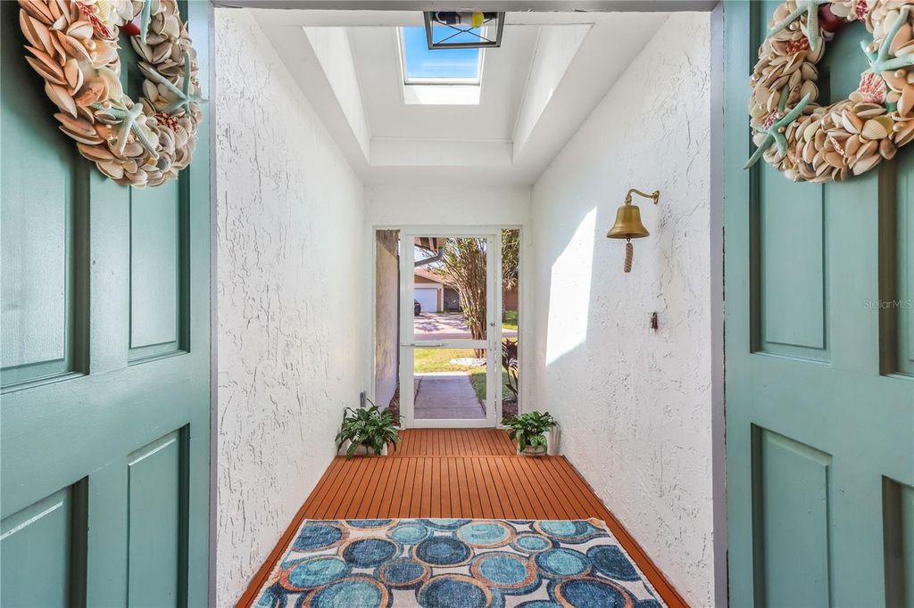 Photo of 1365 Winding Brook Way, Dunedin, FL 34698 (MLS # TB8432999)