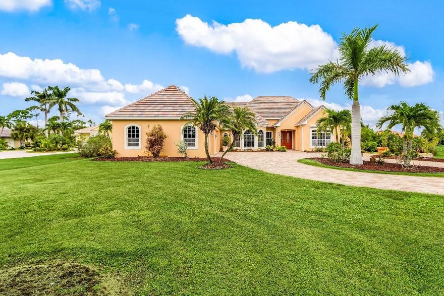 Fabulous estate home on golf course in Burnt Store Marina. Beautifully landscaped one
acre corner lot. Three spacious bedrooms, 3 full baths, office/4 th bedroom. Vaulted
ceilings. Custom wood shutters. The chef’s kitchen boasts light grey oak cabinetry with
birch interiors, a 6 burner propane gas range with griddle, dual electric ovens. A
stainless steel french door refrigerator/freezer with water/ice dispenser, a built in Dacor
microwave drawer, a stainless steel dishwasher, commercial grade stainless steel
exhaust hood. The countertops are Fantasy Brown granite in a leather finish with full
backsplash. Large walk-in pantry. The master suite has 8 ft double french doors. The
master bath is done in marble mosaic tile with walk-in shower, white cabinetry with
elegant granite counters and vanity lighting. The living room with wood burning
fireplace is open to the kitchen with16 ft tray ceilings. Maple cabinetry holds electronic
equipment, wine storage, and a wet bar with stainless steel sink. Triple sliding doors
pocket completely back. A wall mounted control panel can set all of the functions of the
heated pool/spa from inside. Double French doors open from the den/billiard room to
the lanai. The laundry room has a matched pair washer/dryer with stainless sink. The
screen enclosed lanai area is finished with stone pavers and a copper soffit. The
lighted, heated free-form pool with waterfall and spa was just completely re-surfaced.
New glass tile borders the spa and pool. Guests can enter the pool bath from outside.
A new variable speed pool pump was just installed. The rear yard is fully sprinklered
controlled by an automated timer. An electric kevlar screen can be quickly lowered in
inclement weather plus the windows are protected with roll down Kevlar screening. The
whole house can be protected in 15 minutes. The three and one-half car garage has
ample space for a workshop and has a charging station for your electric vehicle. Two
electric panels total 400 amps. All house plumbing is routed through a Manabloc
plumbing box enables the homeowner to control every plumbing line and fixtures from a
central location. The garage floor has been finished in oil resistant epoxy and the long
private circular driveway is fully paved. An 80 gallon hot water heater was recently
installed. A new flat tile roof was just completed as was a new air conditioning system
servicing the master bedroom wing. All new air conditioning ducts, a dust particle
filtration system and additional attic insulation was added. Hardwired burglar alarm
system. Mature clusia trees border both sides of the property to offer privacy. Best value
in Burnt Store Marina.  Sonos sound system, speakers, surround sound, televisions, and stained glass lamps in master bedroom are excluded from conveying with house.