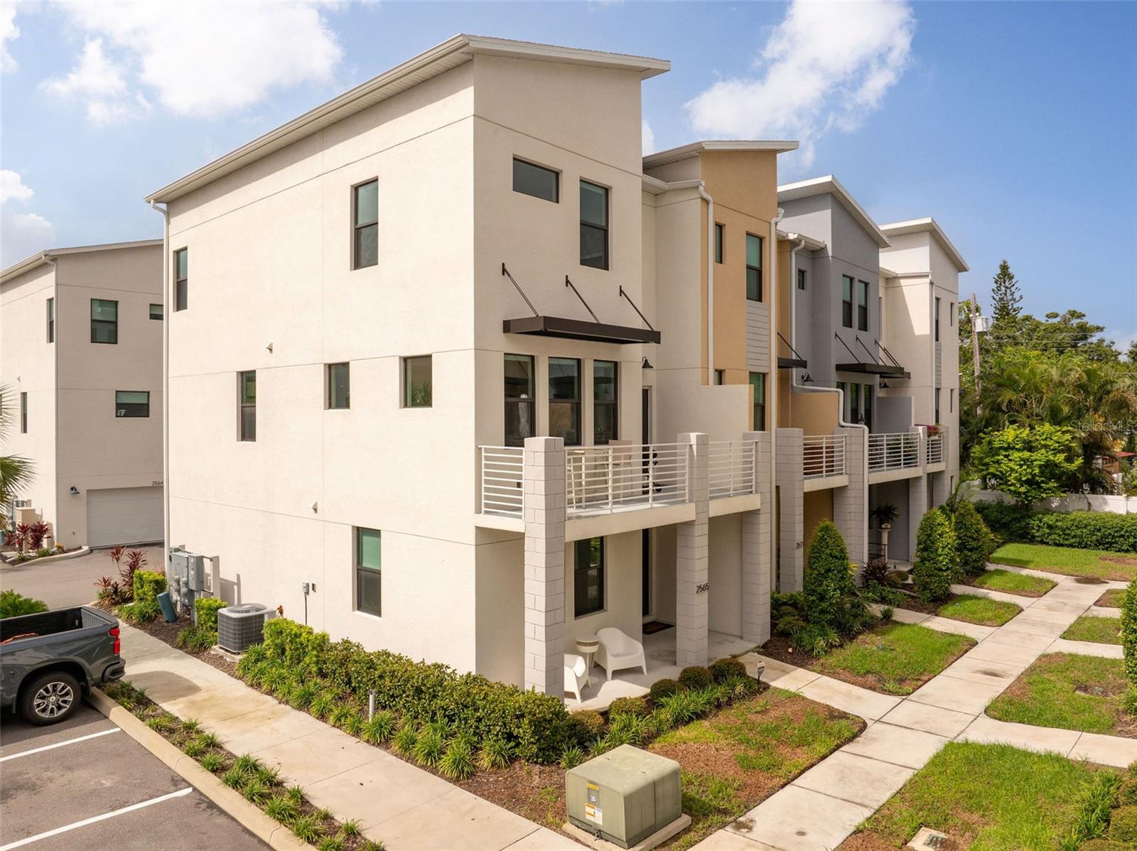 Your Next Chapter Awaits in Uptown Kenwood! Experience modern comfort and low-maintenance living in this stunning three-story, 3 bed, 3.5 bath townhouse with 1,990 sq. ft. of thoughtfully designed space. Located in the highly desirable gated community of Uptown Kenwood, you’ll enjoy unbeatable convenience just minutes from vibrant Central Avenue, Downtown St. Pete, and the Pinellas Trail. This corner lot home offers extra windows and natural light throughout, creating an open and airy feel. Step inside to discover an open-concept layout made for both everyday living and entertaining. The spacious main floor boasts a gourmet kitchen with 42" soft-close cabinets, quartz countertops, a stylish backsplash, and a large island that doubles as a breakfast bar. Flow seamlessly into the dining and living areas, or step outside to the second-floor balcony to relax with your morning coffee or evening glass of wine. Retreat upstairs to the luxurious owner’s suite, complete with a walk-in closet, and spa-like en suite bathroom featuring dual vanities and a frameless glass shower. Even the showers feel like a spa experience thanks to the included water softener — a touch of everyday luxury you’ll love. Two additional bedrooms, each with their own bathrooms, provide the perfect setup for family, guests, or a home office. A convenient laundry room adds to the ease of everyday living. On the entry level, you’ll find a two-car garage with extra storage, and an electric vehicle charger hookup. A welcoming front porch and the third bedroom complete this versatile space. Beyond your home, Uptown Kenwood offers a vibrant lifestyle with resort-style amenities, including a heated pool, grilling areas, fire-pit, and a dog park for your four-legged friends. Stroll or bike to nearby restaurants, shopping, and cultural attractions—all while enjoying the peace of a gated community. Don’t miss your chance to own this beautiful home that blends style, convenience, and location into one perfect package.