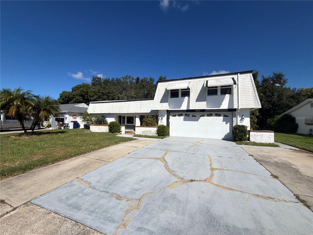 Photo of 4111 Woodsville Drive, New Port Richey, FL 34652 (MLS # TB8558755)