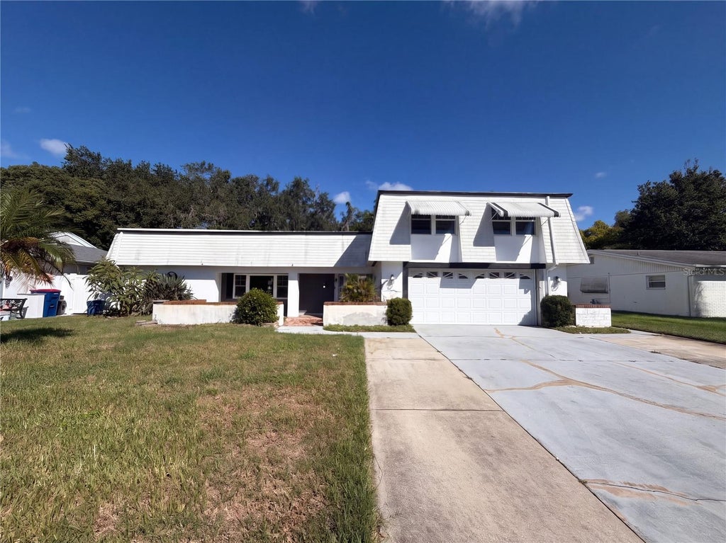 Photo of 4111 Woodsville Drive, New Port Richey, FL 34652 (MLS # TB8558755)