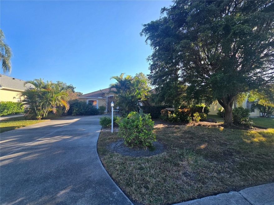3  bedroom, 2 bathroom with Florida room off Primary Bedroom. Wood, Tile flooring, updated kitchen with solid counters. Home has a screen lanai with partially caged area accessed from dining area.  Roof 2020.  Side garage parking.