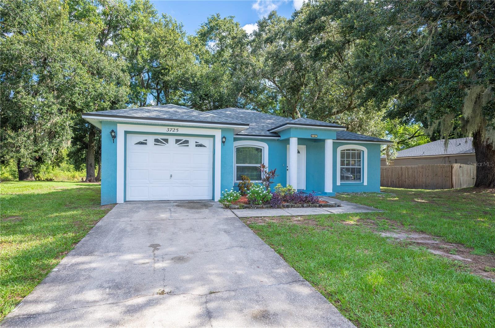 You're sure to fall in Love with this Adorable Home and the Beautiful, Spacious Backyard! Situated in a Wonderful Neighborhood, this 4-Bedroom and 2-Bathroom House has such a great flow and features lovely, Porcelain Tile throughout that lends itself to virtually any choice of design and furniture style. The large, fun and colorful back patio leads to a firepit overlooking an expansive, tranquil backyard with shady oak trees, fruit trees and a terrific spot for grilling. The outdoor space truly feels like an extension of the home..So Perfect for barbecues, playing with the kiddos or just kicking back and relaxing in the fresh air. For added peace of mind, the Roof and the A/C Unit are approximately 4 years old and all of all the windows (with the exception of 1) have been replaced with Double-Pane windows within the last 5 years. And Amazing Location!! Schools, shopping and restaurants are minutes away and the home close to I-4 for easy commutes to Orlando, Tampa or enjoying Florida's Award Winning Beaches! Please call for a Private Showing.