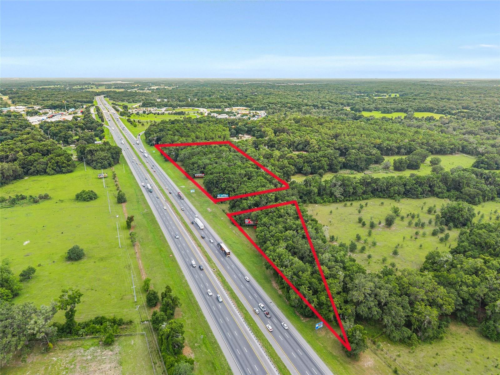 RARE INVESTMENT OPPORTUNITY. Two separate parcels off of I-75/FL-326 Southbound Exit Ramp #358. Both parcels are zoned A-1.
Parcel #12925-001-00 is 1.51 +/- acres (approx dimensions 517x649x198) and Parcel #12925-001-01 is 3.88 +/- acres (approx dimensions 485x266x510x422). Neither parcel has direct road access. The 3.88 +/- acre parcel has two billboards and the 1.51 +/- acre parcel has one billboard. Billboard Income and Lease information is available upon request. High visibility.