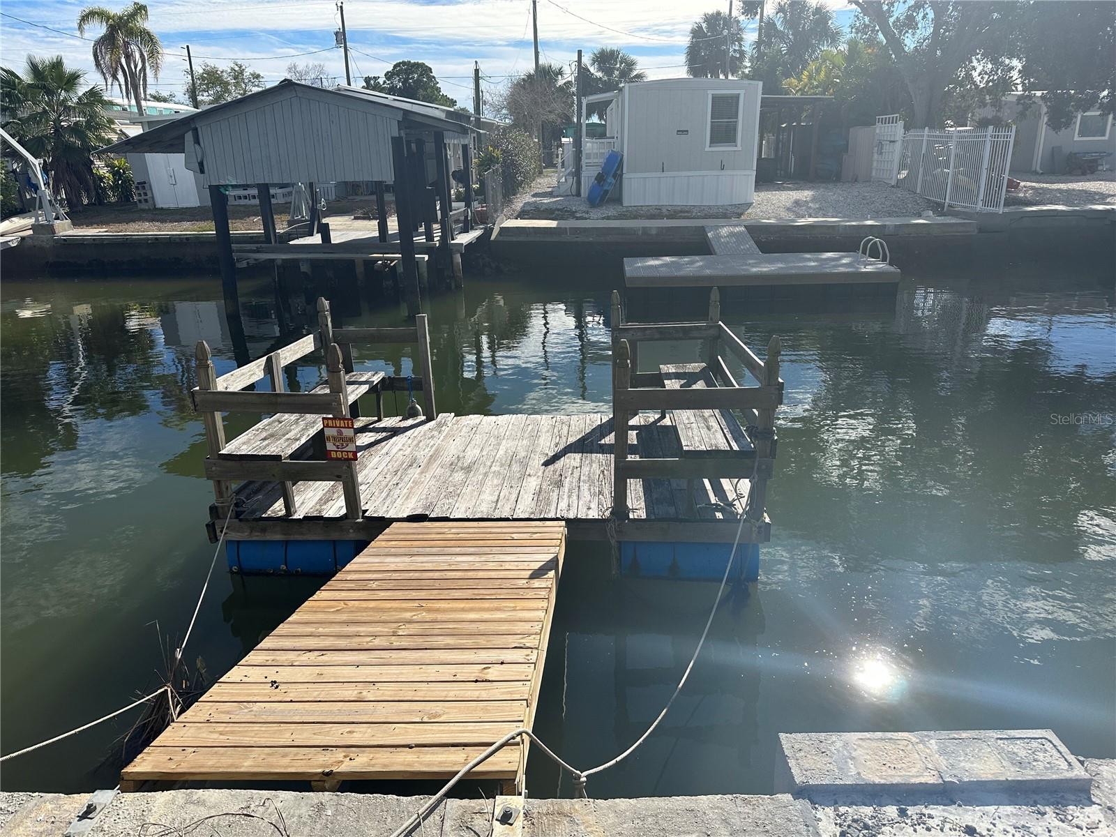 Great location and one of the few waterfront properties with DIRECT ACCESS to GULF OF MEXICO. 40 FT seawall and water is approximately 6-7 deep at low tide and 10+ deep at hightide. Enjoy fishing from your dock. Snook, Redfish, Sheepshead, mullet, blue crabs, and much more. Floating dock can be used to lower your Kayak to the the water. Property also has Electric, Water and Public Sewer available once your home is built. Call today and schedule your tour of paradise.