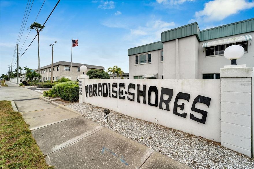 Paradise Shores 55+Community!  Updated 1-bedroom, 1 bath first floor condo with covered parking space. 
Unit offers an open floor plan with living/dining room combo, renovated kitchen cabinets, backsplash, newly installed wood-look flooring through-out. Bedroom offers spacious walk in closet and walk-in shower.  Building exterior has been recently renovated, newer roof, laundry facility, and porches.
Amenities includes: clubhouse, swimming pool, and shuffleboard courts. Close proximity to the beautiful Gulf Beaches!