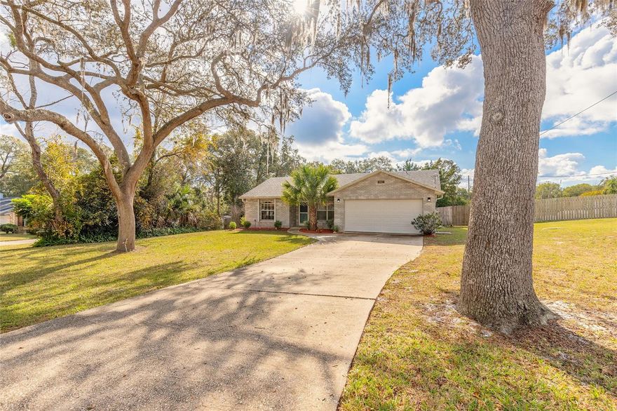 Featuring a private inground pool, large screened back porch, and a NEW ROOF (Jan. 2026), this refreshed 3-bedroom, 2-bath home sits on nearly half an acre in a well-established neighborhood with sidewalks and no HOA, just minutes from DeLand. The single-story layout includes a split-bedroom floor plan, front living room, dining area, and a remodeled kitchen with granite countertops, along with fresh interior paint throughout. A screened porch opens to the pool area via a newly added paver walkway, and the fenced backyard offers space to relax or enjoy outdoor activities. Additional highlights include a 2-car garage, private well and septic for potentially lower utility costs, a whole-house water filtration system and water softener, and accordion-style hurricane shutters on windows and sliding glass doors. Conveniently located near De Leon Springs State Park, Chuck Lennon Park, Lake Woodruff National Wildlife Refuge, and the shopping, dining, and services available throughout DeLand. All information is deemed reliable but not guaranteed and should be independently verified by buyers.