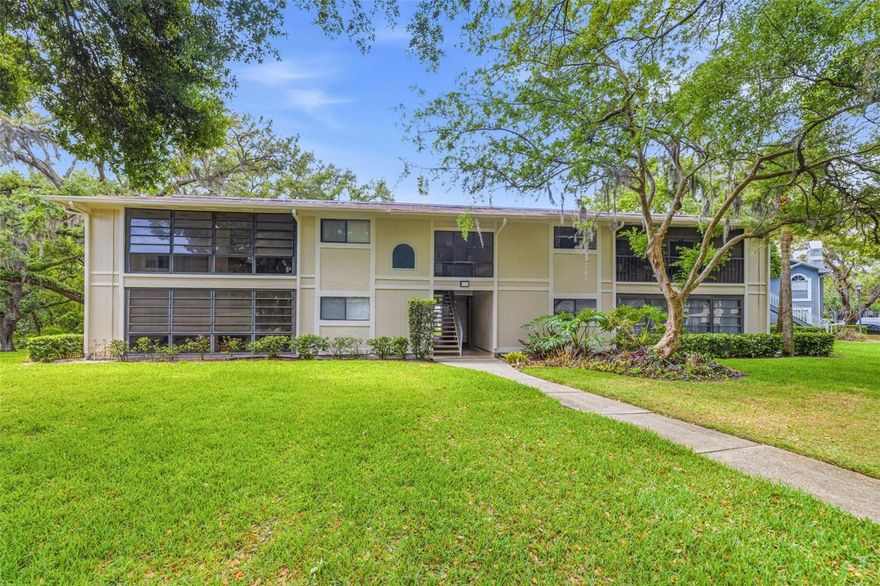 Welcome to Raintree Village, a picturesque, tree-lined community where peaceful ponds and charming bridges create a tucked-away feel while still keeping you close to everything Tampa has to offer. Nestled within Temple Terrace, this location blends natural beauty with everyday convenience in one of the area’s most centrally positioned neighborhoods. This second-floor condo offers 2 bedrooms, 2 bathrooms, and over 1,100 square feet of living space, with no neighbors above you for added privacy. Step inside to an open floorplan that serves as a true blank canvas, ready for your personal touch. The living and dining areas flow seamlessly together, creating an easy and functional layout for both everyday living and entertaining. The kitchen is open to the main living space and features a peninsula-style counter that naturally connects the areas, offering additional prep space and keeping everything feeling open. The primary suite features its own ensuite bathroom and a spacious walk-in closet, while the guest bedroom is thoughtfully positioned next to the guest bathroom, offering a comfortable and private setup for family or visitors. Step outside to your screened-in balcony with privacy shades, creating a quiet outdoor retreat to relax and unwind. A private laundry area adds to the everyday convenience. This home offers incredible potential, making it an excellent opportunity for both homeowners and investors looking to add value. Residents of Raintree Village enjoy a true maintenance-free lifestyle with an all-inclusive HOA that covers water, sewer, trash, cable, high-speed internet, and exterior upkeep. Community amenities include multiple swimming pools, tennis and racquetball courts, walking trails, and a clubhouse, all set within a scenic, waterfront-inspired setting with no flood insurance required. The location is hard to beat, just minutes from University of South Florida, Moffitt Cancer Center, and Busch Gardens Tampa Bay, with easy access to I-75, I-275, and I-4 for a smooth commute throughout the Tampa Bay area. Enjoy being close to local favorites like Temple Terrace Golf & Country Club and Lettuce Lake Park, where you can spend your days golfing, walking scenic boardwalks, kayaking along the Hillsborough River, or simply soaking in the natural beauty of the area. With nearby shopping, dining, and everyday conveniences just minutes away, this location offers the perfect balance of peaceful living and city accessibility. Whether you're searching for an affordable place to call home or a smart investment opportunity in a prime location, this condo is sure to deliver. Schedule your showing today!