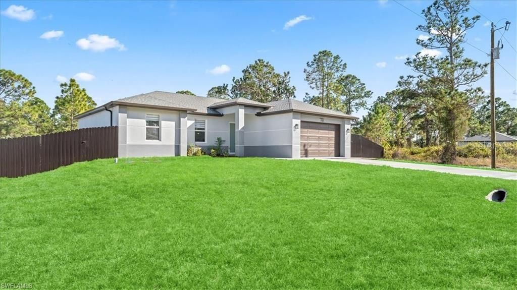 Photo of 761 Silverstar Avenue S, Lehigh Acres, FL 33974 (MLS # A4686318)