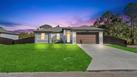 Photo of 761 Silverstar Avenue S, Lehigh Acres, FL 33974 (MLS # A4686318)