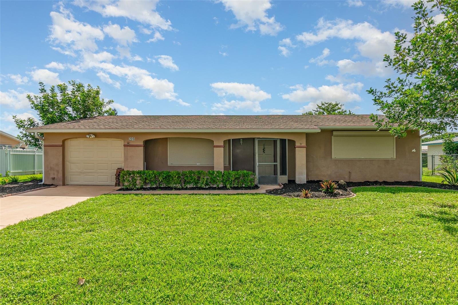 Welcome to your dream retreat! This recently remodeled gem offers the perfect blend of comfort, charm, and modern convenience in a desirable, family-friendly neighborhood—with no HOA, no CDD, and no flood insurance required. Nestled in a no flood zone, this beautiful 2-bedroom home with a spacious den offers a large open-concept layout, ideal for entertaining. The gourmet kitchen boasts granite countertops, updated cabinetry, and all appliances included, making it truly move-in ready. Step inside to enjoy the elegance of new luxury vinyl plank and tile flooring, freshly painted interiors, and a dedicated laundry room. Step outside and unwind in your peaceful, fenced backyard, complete with a lanai, irrigation system, backyard storage, and the serene beauty of aged trees and fresh mulch enhancing curb appeal. Hurricane shutters provide peace of mind, and the home is connected to city water for added convenience. This one-of-a-kind haven is waiting to welcome you—don’t miss your chance to call it home!