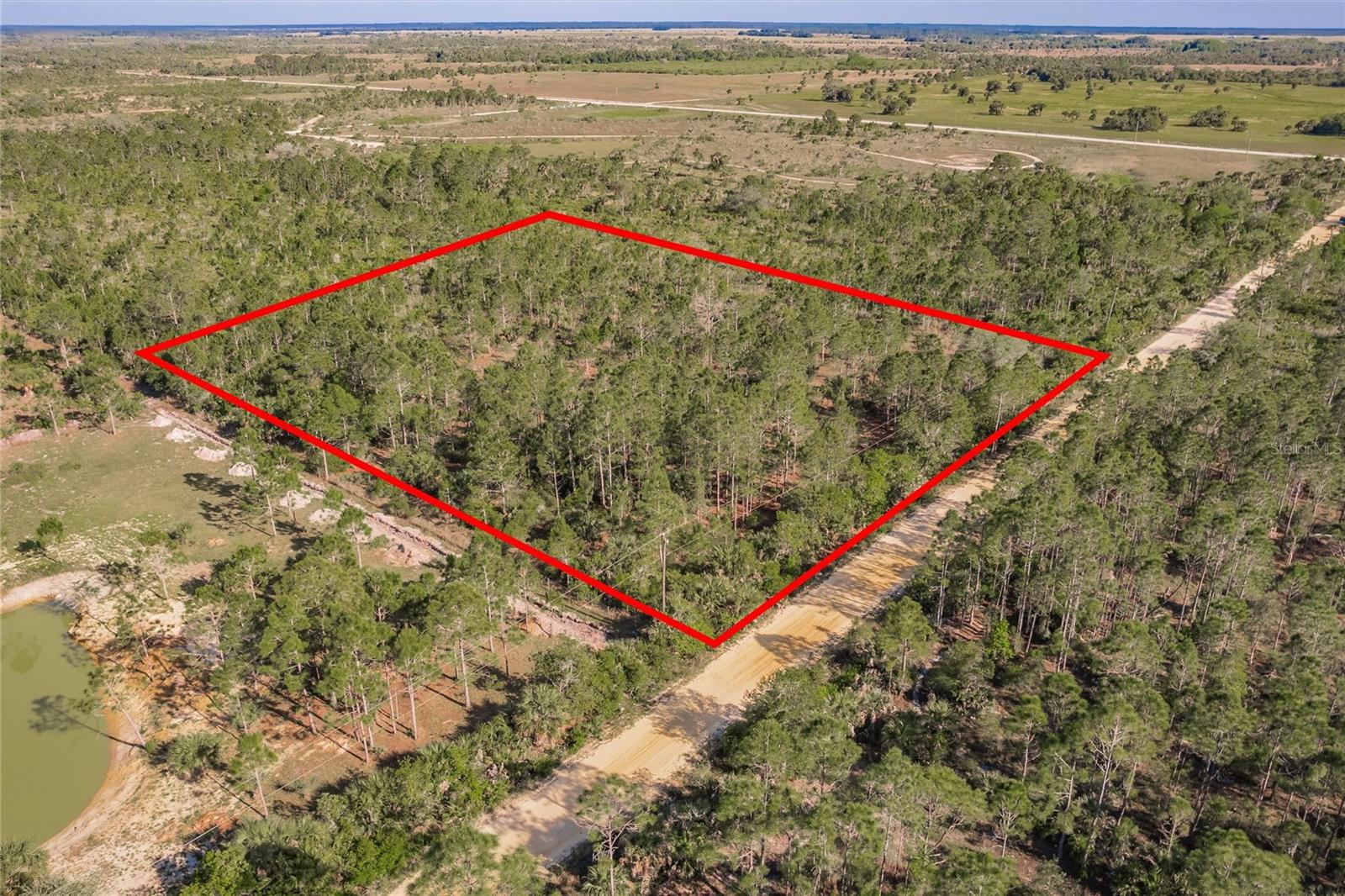 Discover an exceptional opportunity to own 10 acres of prime vacant land in the peaceful Golden Ranches community of Punta Gorda, Florida. This property is high and dry—completely outside the flood zone—making it a secure investment for your future plans. Zoned Agricultural or Residential, the lot offers endless possibilities, whether you're looking to build a custom home, start a farm, or simply hold as a smart long-term investment. With no HOA or deed restrictions, you're free to create your own vision. Electricity is nearby, with well and septic required. Enjoy the privacy of rural living while still being only 25 minutes from downtown Punta Gorda, with easy access to US-17, shopping, dining, and outdoor recreation. With its peaceful surroundings, flexible use potential, and excellent location, this 10-acre lot is a rare find in one of Charlotte County’s most desirable growth corridors.
