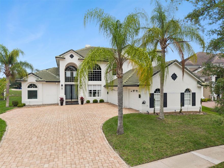 One or more photo(s) has been virtually staged. **Partial or full furnishing price package available separately**Welcome to this luxury residence in the GUARD-GATED golf community of Stoneybrook East, where refined design, modern innovation, and breathtaking views come together to create a truly one-of-a-kind home. Offering over 3,300 SQUARE FEET, 4 bedrooms, and 2.5 baths, this POOL HOME is perfectly positioned on a highly sought-after street with sweeping pond and golf course views. From the moment you arrive, the home makes a lasting impression with its elegant curb appeal, expansive 3-CAR GARAGE with epoxy flooring, and a sense of sophistication. Inside, you’ll find a stunning, high-tech modern interior, THOUGHTFULLY UPDATED over the past three years with 3 NEW HVAC SYSTEMS, luxury appliances, wood-look tile flooring, designer lighting, remodeled bathrooms, custom ceiling beams, smart fans, and more.The open-concept layout is elevated by SOARING VAULTED CEILINGS and striking architectural details, including arched windows that flood the home with natural light. The Living Room serves as a warm yet refined gathering space, complete with a WOOD-BURNING FIREPLACE and sliding glass doors that open to the outdoor oasis. A formal Dining Room features a CUSTOM BRICK AND GLASS WINE CELLAR with a built-in dehumidifier, beautifully tucked beneath the UPDATED WOOD STAIRCASE—perfect for showcasing your collection and entertaining in style. At the heart of the home, the CHEF'S KITCHEN is a masterpiece, featuring quartz countertops, NEW DESIGNER CABINETRY, subway tile backsplash, high-end stainless steel appliances including built-in ovens and a cooktop stove, luxury lighting, and an oversized island with breakfast bar seating. The adjacent Family Room is equally impressive, highlighted by WOOD CEILING BEAMS, expansive windows, and sliding doors that invite the outdoors in. Retreat to the Primary Suite, complete with large windows and direct access to the patio and pool, a spacious walk-in closet, and a SPA-INSPIRED en suite bath. This beautifully remodeled space includes dual vanities, a soaking tub, a step-in shower, a private water closet, and even a TOWEL WARMER for a touch of everyday luxury. A VERSATILE OFFICE, accessed through French doors, features a stylish accent wall and can easily serve as a fourth bedroom, with a nearby half bath for convenience. The Laundry Room is thoughtfully designed with cabinetry, a utility sink, washer and dryer, and a fold-down ironing board. Upstairs, a SPACIOUS LOFT overlooks the Family Room below and features glass doors leading to a private balcony with views of the pool and lanai. Two additional GENEROUSLY-SIZED Bedrooms and a full Bath complete the upper level. Step outside into your PRIVATE RESORT-STYLE OASIS, where an in ground pool and spa with NEW HEATER are set within an oversized, vaulted screened lanai, perfectly framing the tranquil pond and golf course views. Residents of Stoneybrook East enjoy access to EXCEPTIONAL AMENITIES, including a clubhouse, resort-style pool, fitness center, tennis courts, playground, scenic trails, and a championship golf course, along with a full calendar of community events and activities. Ideally located in Stoneybrook East, the home is just minutes from TOP-RATED SCHOOLS, the University of Central Florida, and shopping, and dining at Waterford Lakes Town Center. This is more than a home—it’s a LUXURY LIFESTYLE defined by elegance, comfort, and breathtaking surroundings. Call and schedule your showing today!