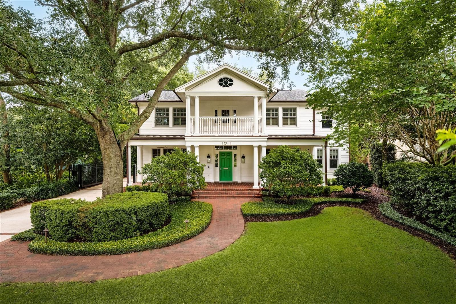 Set on a coveted tree-lined brick street in one of Orlando’s most storied neighborhoods, this 1935 estate blends classic architectural beauty with luxurious modern updates. With direct views of Lake Davis, the home is set on an oversized lot that lives like a private retreat in the heart of the city.
Step inside to discover light-filled living spaces with exquisite finishes and rich architectural detail throughout. The layout offers excellent flow, with two distinct living areas, a library, and French doors along the back of the home that open to the outdoor entertaining spaces. One of the four bedrooms is located on the main floor—ideal for guests—with a large walk-in closet and private en suite bath. Upstairs, the spacious primary suite feels like a fine hotel, featuring a beautifully designed bathroom and a generous his-and-hers walk-in closet.
The kitchen is a chef’s dream, outfitted with a Sub-Zero six-drawer refrigerator, Wolf six-burner natural gas range, double ovens, Viking wine cooler, marble countertops, and a generous island for dining and gathering. Just off the kitchen, a stylish mudroom doubles as a hidden prep space with room for appliances and adds additional functionality for entertaining.
Designed for both refined gatherings and everyday comfort, the home embraces seamless indoor-outdoor living. The professionally designed grounds by acclaimed landscape architect Joe Knight include a large pool with a heated spa, a charming pergola, a built-in grill, and a pool cabana with its own half bath—perfect for hosting and relaxing in style.
Additional highlights include a two-car detached garage, a gated driveway with secure off-street parking, a new roof, tankless water heaters, and A/C units installed in 2023, and abundant storage throughout the home. Every inch of this property has been lovingly maintained and is in pristine condition. Conveniently located just minutes from downtown Orlando, Orlando Health, and I-4 and zoned to top rated Blanker and Boone.
This is a rare opportunity to own a piece of Orlando history—expertly updated and thoughtfully designed for modern living.