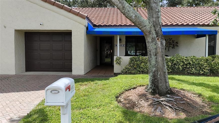 4002 87th Terrace is a lovely 2-bedroom, 2-bathroom, split-plan villa in the Mainlands of Tamarac Unit 7 “Las Villas” 55+ community in Pinellas Park, FL. Roof (tile, 2004), HVAC (2022), water heater (2020, 40 gal), impact windows (2015). This spacious, lovely one-story home is designed for easy living and includes an attached 1-car garage. This home has beautifully updated kitchen with coffered ceiling, eat-in kitchen space, wood cabinets and recessed lighting, while both bathrooms have been tastefully updated, as well. The open feel of a living room/dining room combo coupled with a kitchen pass-through to the dining area make THIS the home you've been looking for! Especially with the covered patio just off the kitchen, making in the perfect spot for al fresco dining, cocktails, and entertaining friends and family. With a semi-open floorplan and split-bedroom layout there's privacy for everyone. The large primary bedroom features a private ensuite bathroom with a walk-in closet, dual-sink vanity, recessed lighting and a step-in tile shower with built-in shower seat. Best of all, this home is not in a flood zone and the monthly maintenance fee includes internet AND cable AND sewer/water/trash (so the only utility payment for owners is the electricity). Experience comfort, convenience, and community—schedule your private tour of 4002 87th Terrace today and discover the best of 55+ living, centrally located in the heart of Pinellas County.