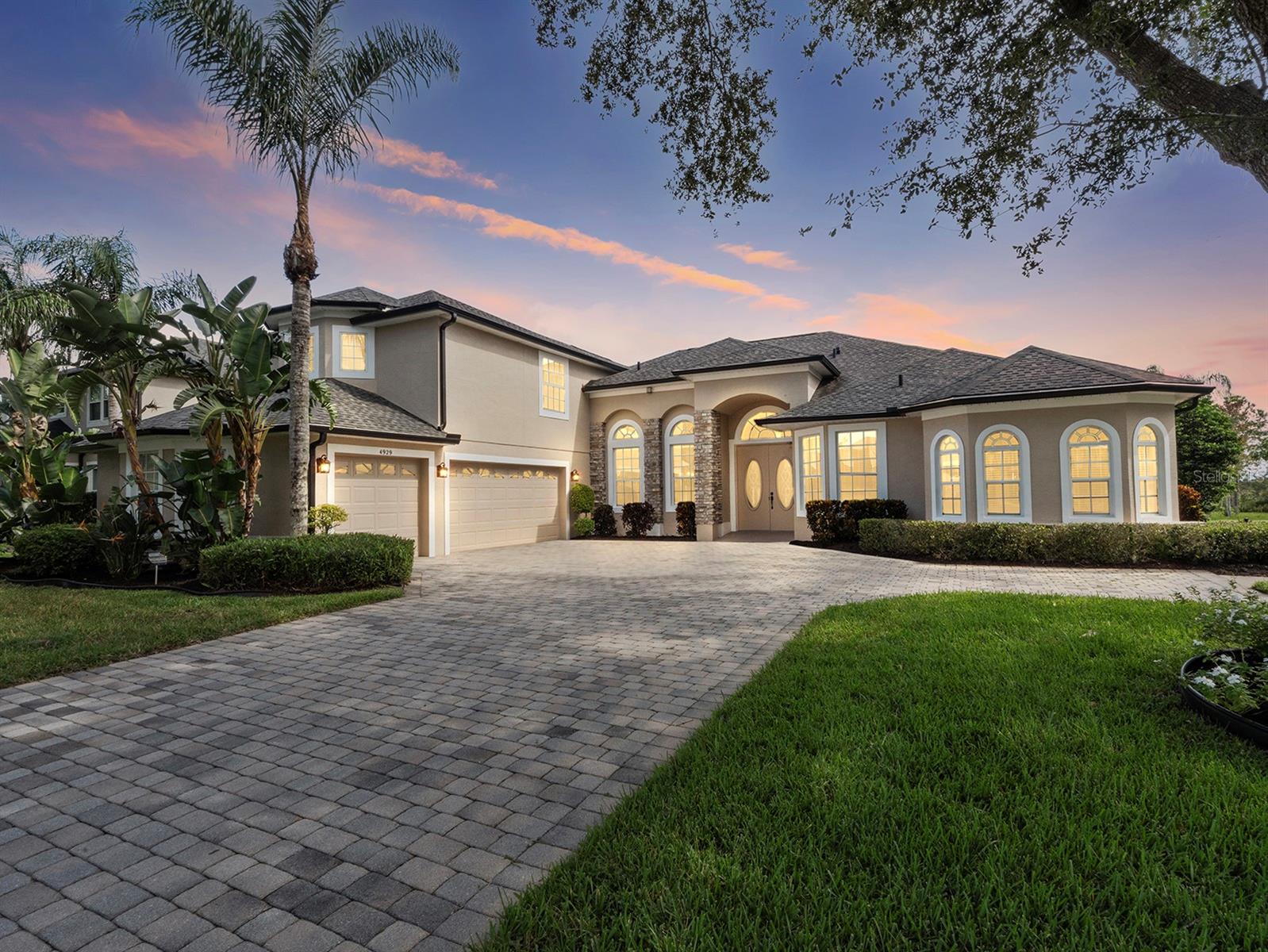 Welcome to 4929 Parkview Drive, an exquisite waterfront retreat on scenic Fells Cove offering space, style, and serene views. This 5-bedroom, 4.5-bathroom pool home (with the 5th bedroom currently used as an office) is thoughtfully designed to capture natural light and water vistas from many rooms, blending elegance with everyday comfort.
Inside, high ceilings, crown molding and a seamless mix of engineered hardwood and tile create timeless sophistication. The formal living and dining rooms provide a grand first impression, while the spacious family room flows into the open kitchen with granite countertops, cooktop, double oven, breakfast bar, and a cozy dining nook overlooking the pool and cove. Granite continues into the laundry room and the pool bathroom. The primary suite is a true retreat with tray ceilings, French doors leading to the lanai, dual walk-in closets, and a spa-inspired bathroom featuring separate vanities, a soaking tub, and a roll-in shower and retractable grab bars. Upstairs, a large bonus room with its own full bath offers endless possibilities for a guest suite, game room, or media space.
Step outside to your screened saltwater pool and spa, surrounded by paver decking and lush landscaping, perfect for entertaining or quiet sunset evenings. The pool enclosure was rescreened in 2022, the pool heater is only 2 years old, and the pool heat is controlled through the ease of an app. There's even an automatic pool filler! The slider door to the lanai and the exterior door from the pool bath are newer as well.
Major systems are already updated: AC units (2017 & 2019) with UV light added in 2025 and 4-zone control, roof (2020), water heater (2021), leaf gutter filtration system (2021), and a whole-house propane generator (2014). Fresh exterior paint and mulch were just completed in 2025. Handicap accessibility features include the automatic front door, plus roll-in showers and retractable grab bars in the primary and pool baths.
Set on a .41-acre lot with direct water views and a conservation backdrop, this residence combines luxury, comfort, and thoughtful updates in a sought-after location just minutes from Lake Nona, Orlando International Airport, and Central Florida’s theme parks.
Lake Pointe at Toho is a gated community that offers residents access to a community pool, covered tot lot and playground, tennis, pickleball and basketball courts, BBQ grills and picnic benches, and scenic walking paths and seasonal community events. Publix is just 2 miles up the road as well! Nearby attractions include Lakefront Park, where you can take peaceful walks by the water, enjoy playgrounds, or go boating on East Lake Tohopekaliga. Theme parks like Disney and Universal are a quick 40 mins or so away while Cocoa Beach is about an hour drive. With major highways such as 417 and the Florida Turnpike nearby, commuting to Orlando or the theme parks is quick and easy. This is more than a home—it’s a lifestyle of luxury and waterfront living.
