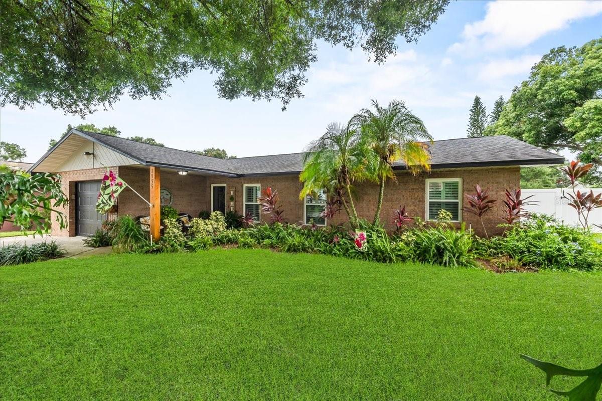 Under contract-accepting backup offers. Under Contract but accepting back up offers! Lake Life Meets Designer Luxury! Welcome to 1155 N 11th St, Eagle Lake, where modern elegance and Florida living come together just steps from Lake McLeod. Enjoy lake views from your driveway and quick access to the public boat ramp at the end of the street - great for boating, fishing, or sunset cruising. Step inside and fall in love with this fully renovated 3-bedroom, 2-bathroom home, where every detail has been carefully crafted. The first thing you'll notice - A stunning brick wood-burning fireplace framed by a shiplap accent wall, creating an inviting focal point that feels like home. The custom kitchen is a showstopper and chef's dream! Featuring an upgraded waterfall island with gorgeous high class porcelain countertops, custom white cabinetry, a gas range with a custom hood vent, inset refrigerator with wrap around cabinetry, and a beautiful glass tile backsplash-perfect for the home chef who appreciates style and function. Additional upgrades include: roof 2021, A/C system 2021, and all-new ductwork 2025, luxury vinyl plank flooring with wide planks. Windows replaced with double pane windows in 2021 and had custom plantation shutters fitted to windows in 2021, large baseboards 2021, renovated bathrooms, including a spa-inspired primary suite with an oversized tiled walk-in shower and elegant vanity and water heater. There's nothing to do here! Also a new shed for additional storage! Outside is your personal retreat! Enjoy a beautifully landscaped backyard complete with a fire pit for entertaining or relaxing under the stars. The vinyl fencing provides both privacy and charm. Relax in the sunroom with a view of your backyard oasis, or head to the lake for an evening on the water. All appliances including washer and dryer stay with the home, making this an effortless move-in. If you're searching for a home that offers designer finishes, thoughtful upgrades, and a wonderful location near Lake McLeod, this is the one.