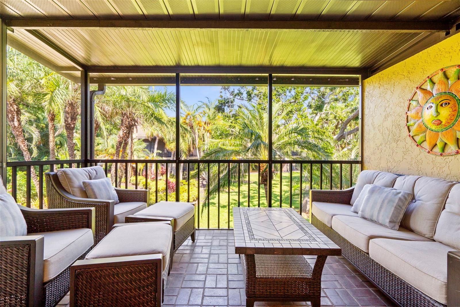 Welcome home to this beautiful second floor end unit condo located in desirable Ashton Lakes. A stone's throw from Siesta Key Beach, this meticulously maintained condo presents as a model home, offering a harmonious blend of sophisticated design and resort-style amenities. Step inside and be captivated by the expansive, open-concept living space, with cathedral ceilings. The gourmet kitchen, a focal point of this condo, showcases elegant granite countertops and stainless steel appliances. The thoughtfully designed kitchen bar seamlessly flows into the dining area, creating an ideal setting for entertaining. The expansive double living room provides versatile options for relaxation and recreation, accommodating both intimate moments and larger social events. The intelligently designed split-bedroom floor plan ensures optimal privacy, with the primary suite and guest accommodations thoughtfully positioned on opposite sides of the condominium. The primary bedroom offers captivating views, a luxurious en-suite bathroom, and walk-in closet, providing a serene retreat. The guest bedroom is also well-appointed with convenient access to the adjacent guest bathroom. Extend your living space outdoors onto the private lanai. The lanai's eastern exposure provides a picturesque setting for enjoying breathtaking sunrises over the lush garden and serene lake, creating an idyllic backdrop for your morning coffee. This condo also features a carport, perfect for protecting your vehicle on those warm Florida days. Ashton Lakes is a meticulously maintained community offering an array of resort-style amenities designed to enhance your lifestyle. Residents enjoy access to two sparkling swimming pools (one of which is exceptionally large), tennis/pickle ball courts, shuffleboard courts, and a well-appointed clubhouse serving as a social hub for the community. During the winter months, a vibrant social calendar filled with engaging events provides ample opportunities to connect with neighbors and create lasting friendships. This exceptional condominium presents an ideal opportunity for those seeking a winter retreat or a permanent residence in a prime location. Come embrace the Ashton Lakes lifestyle and experience Florida living for yourself. New water heater 2023, new A/C 2023, new lanai screens and window screens 2020, new roof and exterior paint 2020. Please see attachments for additional updates. Furniture available for purchase on separate contract.