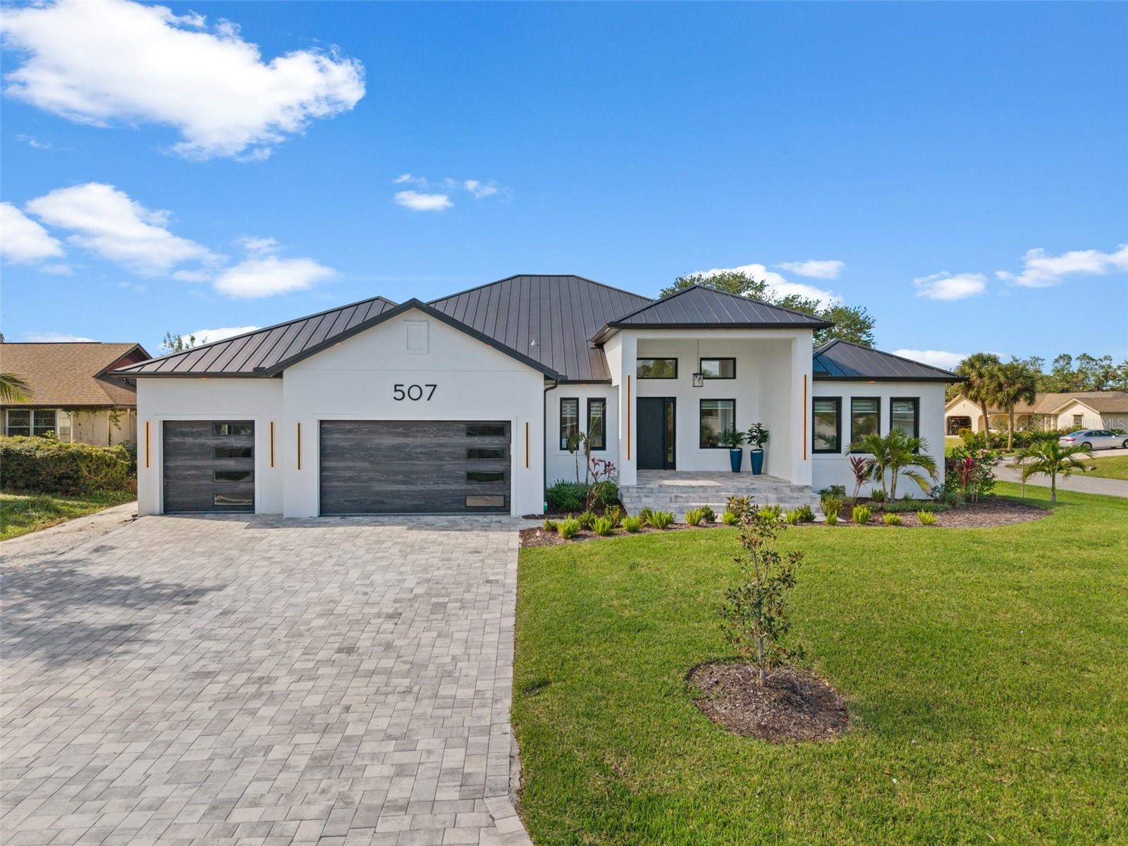 No HOA or CDD fees- enjoy total freedom and flexibility in this exceptional custom-built home located in Nokomis, just minutes from the pristine sands of Nokomis Beach and the vibrant shops and restaurants of Venice and Sarasota. Barely a year old, this residence showcases stunning high-end finishes, modern design, and thoughtful details throughout.
Step inside through a grand, elegant entrance that immediately sets the tone for the home’s refined character. The beautiful curb appeal is matched only by the spacious interior, offering 5 bedrooms and 4 luxurious bathrooms thoughtfully laid out to provide both comfort and privacy.
The heart of the home is a spectacular, oversized chef’s kitchen featuring custom cabinetry, premium appliances, and an expansive layout perfect for gatherings. The kitchen overlooks the sparkling saltwater pool and lanai through oversized hurricane-rated sliding glass doors that seamlessly blend indoor and outdoor living.
The living room exudes designer sophistication with acoustic wall paneling accented by LED lighting and an electric fireplace that adds warmth and ambiance. The dining room sits conveniently adjacent to the kitchen, creating an effortless flow for entertaining and family meals.
The spacious en-suite bedroom is bright and inviting, offering a serene retreat with a modern, spa-inspired bathroom. Four additional bedrooms are thoughtfully positioned throughout the home to maximize privacy and functionality. Each of the four bathrooms showcases contemporary fixtures and elegant finishes.
The oversized screened lanai is truly an entertainer’s dream, providing plenty of space to relax or host guests. Enjoy the heated saltwater pool with its majestic waterfall feature, soak in the hot tub under the stars, or unwind in the covered seating areas that feel like a natural extension of the home.
Additional features include a 3-car garage with a hurricane-rated door, ensuring safety and ample storage.
Situated in one of Nokomis’s most desirable areas, this home combines luxury living with unbeatable convenience. You’ll love being just 0.3 miles from Nokomis Beach, a hidden gem known for its peaceful atmosphere and natural beauty, as well as close to Oscar Scherer State Park, legacy bike trails, golf courses, and charming historic downtown Venice. This property is also within a top-rated school district, making it an outstanding choice for families seeking both quality education and an exceptional lifestyle.
Schedule your private showing today and discover the unmatched beauty and comfort of this extraordinary Nokomis home. *** PROPERTY OFFERED FULLY FURNISHED AND EQUIPPED.
