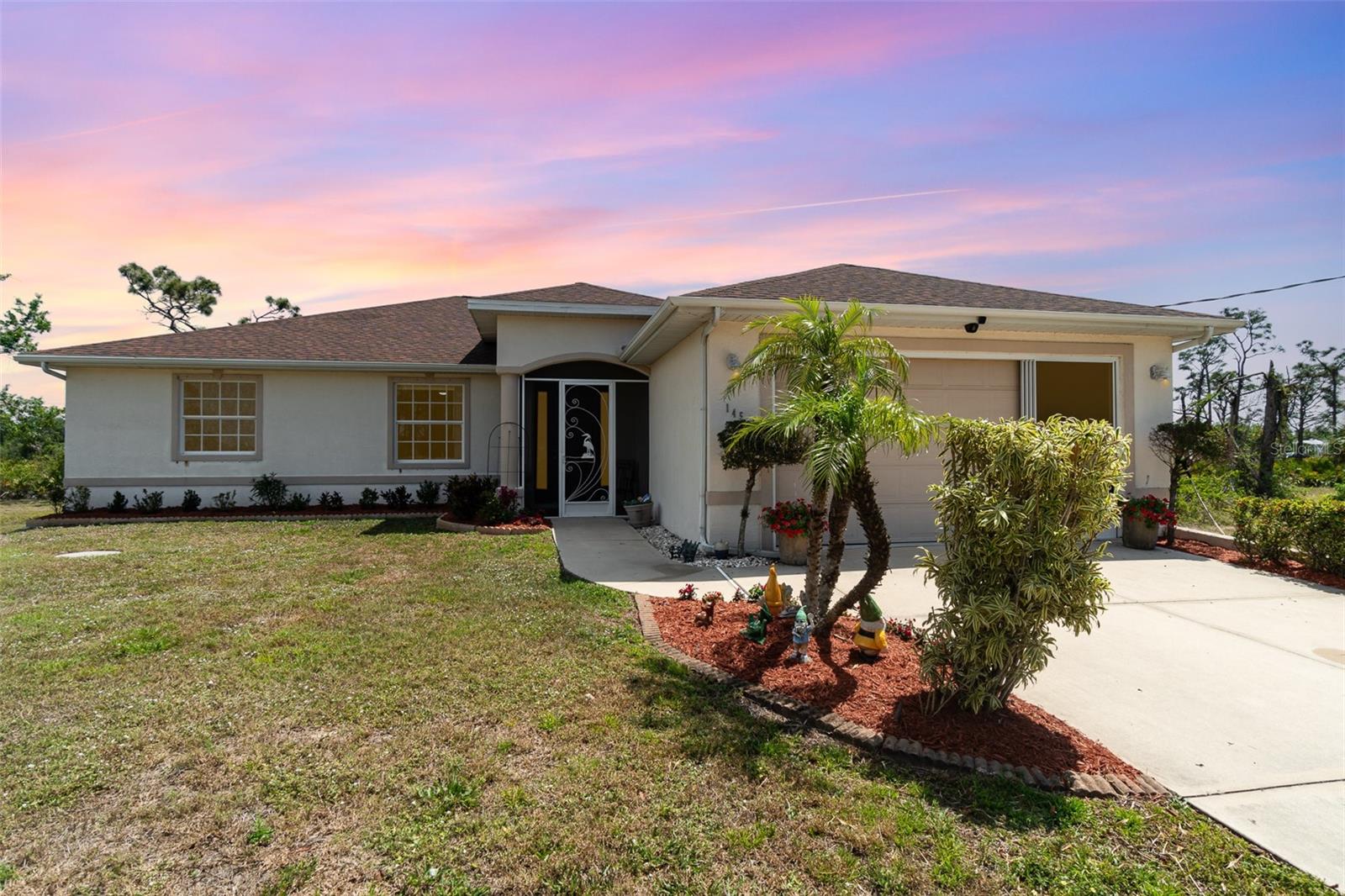 SPACIOUS 3 Bedroom, 2 Bathroom, 2 Car Garage, Pool home located in the Rotonda Sands community in Placida. LOW HOA FEES & NO FLOOD REQUIRED! CLICK ON THE VIRTUAL TOUR LINK 1 FOR THE VIDEO AND VIRTUAL LINK 2 FOR THE 3D TOUR. This lovely home features a bright & open floor plan, high & tray ceilings, recessed & pendant lighting, and MUCH MORE! Effortlessly entertain friends and family in the expansive living and dining rooms, highlighted by generous windows and a glass slider that invite abundant natural light. The EAT-IN kitchen offers ALL stainless-steel appliances, kitchen reverse osmosis system, Quartz countertops, TWO breakfast counters, and plenty of cabinets for storage. The spacious master bedroom has a glass slider to the lanai, TWO closets, and a private ensuite bathroom with a dual sink vanity, soaking tub, and a walk-in shower. The guest bedrooms are on a split floor plan, providing plenty of privacy, with a shared guest bathroom nearby. Start your day with a peaceful cup of coffee or unwind with your favorite evening drink on the lanai. Take a dip in the private heated pool, perfect for year-round enjoyment, or soak up the sun on the pool deck. Whether you want to create a garden, set up a play space, or simply enjoy the outdoors with peace of mind, this FULLY FENCED backyard is ready for all your needs. 2022 ROOF - SCREENED ENTRY, SCREENED GARAGE - RAIN GUTTERS - HURRICANE PROTECTION - LANDSCAPING. Rotonda Sands is a quiet, deed-restricted neighborhood just a short ride to local beaches! Located close to local shopping & boutiques, fine & casual dining, LIVE Entertainment, and World Class Fishing & Boating! Schedule your showing TODAY!