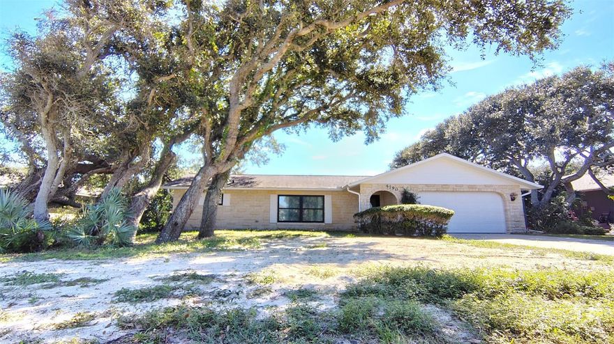Welcome to 4790 Michael Lane, a charming single-family home located in the beautiful coastal town of Ponce Inlet, FL. This well-maintained residence was built in 1988 and offers a cozy and inviting atmosphere for its new owners.This property provides ample outdoor space for relaxation and entertainment. The lush landscaping and mature trees surrounding the home create a serene and private setting for residents to enjoy.  The layout of the home is thoughtfully designed to maximize comfort and functionality, with an open-concept living and dining area that is perfect for hosting gatherings with family and friends. A master bedroom, full bath and large walk in closet occupy one wing of the home, which leads to the pool through custom french doors. Two bedrooms and another full bath occupy the other wing, which also leads to the pool deck. This offers residents and guests both privacy and easy pool access.The kitchen is equipped with modern appliances, ample cabinet storage, and a large, central granite bar for casual dining. The bedrooms are spacious and offer plenty of natural light, providing a peaceful retreat for rest and relaxation. Bedroom floors and bathrooms are ready to be styled to your dream vision. All boast large closets with fully mirrored doors. Other highlights of this property include a two-car garage, an open air pool, and a backyard that is ideal for outdoor activities and hobbies. Whether you're looking to host a barbecue, cultivate a garden, or simply unwind in the sunshine, this home has everything you need to make the most of Florida living. Neither pesticides nor fertilizers have been used on the grounds, making the property organic and safe for animals and children.In addition to its charming features and convenient layout, 4790 Michael Lane is located in a desirable neighborhood known for its peaceful ambiance and proximity to local amenities. Residents can enjoy easy access to the beach, parks, dining and more, making it a truly idyllic place to call home.Important recent improvements include, custom front hurricane door, custom double hung windows in main areas, new HVAC and ductwork, new sockets and switches throughout, new soffit and gutters, new Hardie board siding and brand new top quality paint job. The septic field was replaced in 2025, providing an important update. The aluminum fence surrounding the backyard is also new and provides swing shut, locking gates. The interior main area is equiped with light reflective USA made VCT flooring that is recyclable. The ceiling fans are also new and the chimney was rebuilt to provide a ready-to-use wood burning fireplace. There is new, dimmable recessed lighting in the kitchen and the library and dining room light fixtures are vintage. Many thoughtful improvements have been made to adhere to energy efficiency and USA made updates. Overall, this property offers a wonderful opportunity for buyers seeking a comfortable and stylish home in a sought-after location. Don't miss your chance to make 4790 Michael Lane your own and start living the coastal lifestyle you've always dreamed of.