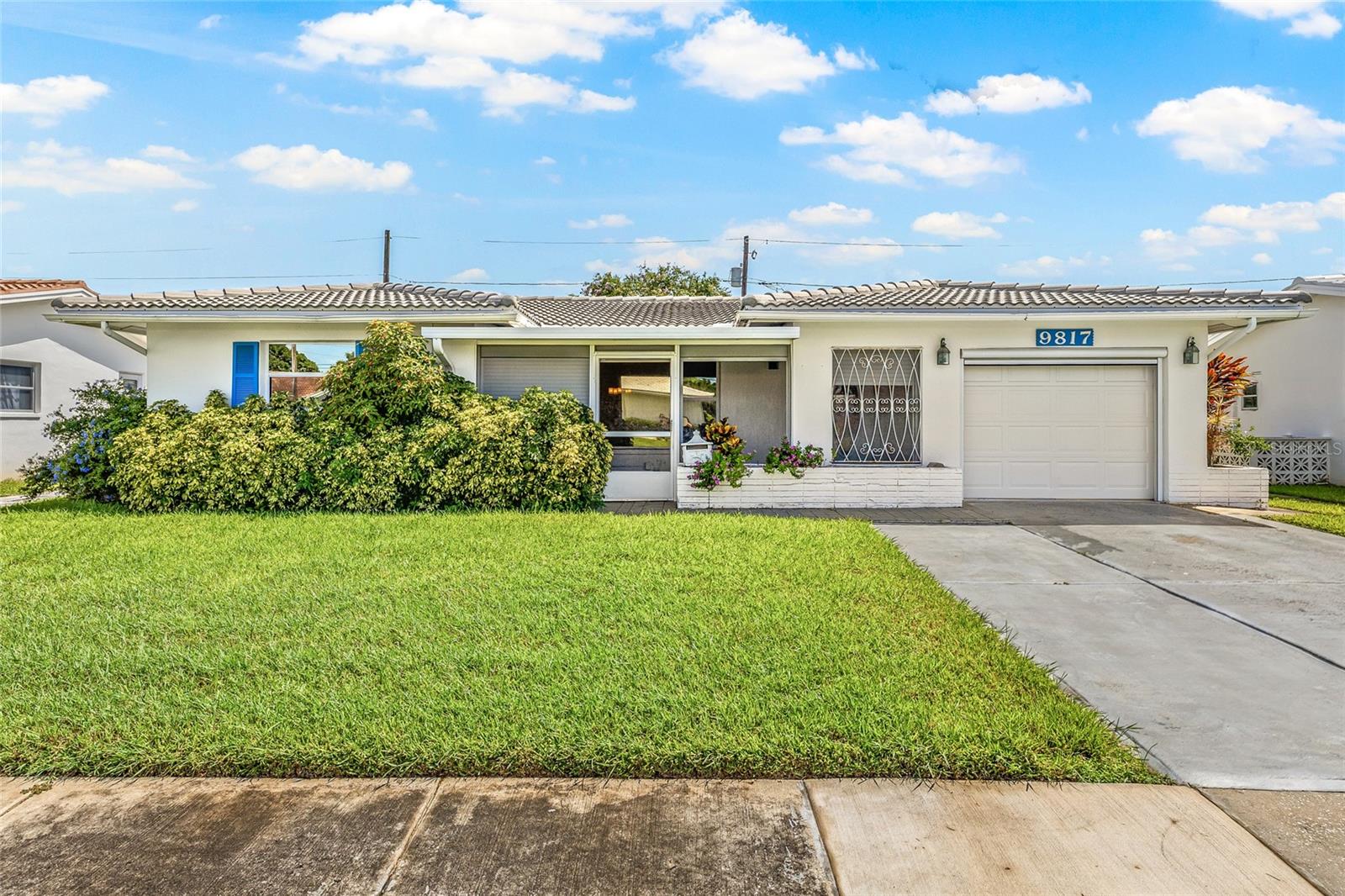 Welcome to the highly sought-after Mainlands of Tamarac (Unit 3) – a 55+ community where comfort, convenience, and an active lifestyle come together. This desirable Eden Model offers 2 bedrooms PLUS a den, 2 full bathrooms, and a light-filled interior designed for both everyday living and entertaining. The thoughtful layout features a dining room off the kitchen, a Florida room, and an enclosed front lanai – providing plenty of space for relaxing. (Prefer a more open layout? The wall between the dining area and office can easily be removed.) The kitchen offers abundant built-in storage along with a newer stove and dishwasher. The home also includes a 1-car attached garage with laundry hookups, a remote-operated garage screen, and a widened driveway for extra parking. The entrance door, front screen, and primary bathroom door are all wider than standard for added accessibility. Recent updates offer peace of mind, including a 2024 roof replacement (covered by the association) and a water heater just three years old. Enjoy low-maintenance living with a monthly fee under $500, covering roof and exterior maintenance, exterior painting, cable, internet, sewer, water, trash, and basic lawn care – including sprinkler maintenance and lawn spraying. As a Mainland’s resident, you’ll have access to fantastic amenities: pool, clubhouse, shuffleboard, and a variety of community activities – all just steps from the Mainlands Golf Course and minutes to shopping, dining, airports, and more. Here, you’ll enjoy the comfort of single-family living with all the ease of condo ownership.