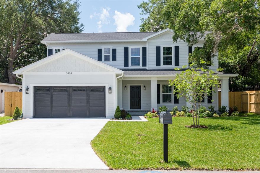Beautiful new construction with timeless details, expansive covered front and rear porches, and a thoughtfully designed floor plan ideal for entertaining and everyday living. This 5 bedroom, 4 bathroom home features a large welcoming entryway, formal dining room, and open-concept kitchen and family room centered around a large quartz island with fluted panel detailing, walk-in pantry, and oversized sliders leading to the fenced backyard. The spacious first-floor primary suite offers an oversized walk-in closet and spa-like bathroom with dual vanities, freestanding tub, walk-in shower, linen closet, and private water closet. An additional downstairs bedroom is ideal for guests, a home office, or playroom, while the laundry room is conveniently located off the custom drop zone. Upstairs, natural light fills the loft and stairwell through transom windows, creating the perfect secondary living space. Two bedrooms share a Jack-and-Jill bathroom with double vanities and separate toilet/shower, while the fifth bedroom features a bathroom accessible from both the bedroom and loft. Every bedroom features a walk-in closet and quartz countertops extend throughout all bathrooms, complemented by timeless and elegant flooring and tile. Conveniently located minutes from Publix, Target, Ballast Point Park, Bayshore Boulevard, and the Selmon Expressway.