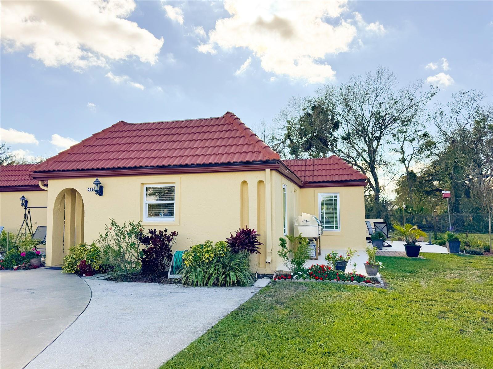 The neighborhood of Christian Retreat Villas are where country meets 55+ community living. This 2 bedroom, 2 bath freshly renovated villa is the Florida retirement dream, featuring a spacious open concept and wonderful outdoor entertaining space. Some notably unique parts of this villa are a galley kitchen leading into a small butlers pantry, a master en suite with a large walk in closet, a shared enclosed garaged parking space, and a sun room with incredible natural lighting. The Villa has seen recent renovations including brand new water lines throughout, vinyl flooring, hurricane impact windows, attic insulation, refreshed bathrooms and kitchen, a 2025 A/C, and a 2023 redesigned roof structure that provides a 30 YEAR warranted roof, which is unheard of in this community. This community also offers water to the access the Manatee River for canoes and kayaks. This villa has charm, character, and a refreshed look and is waiting for you to call it home.
