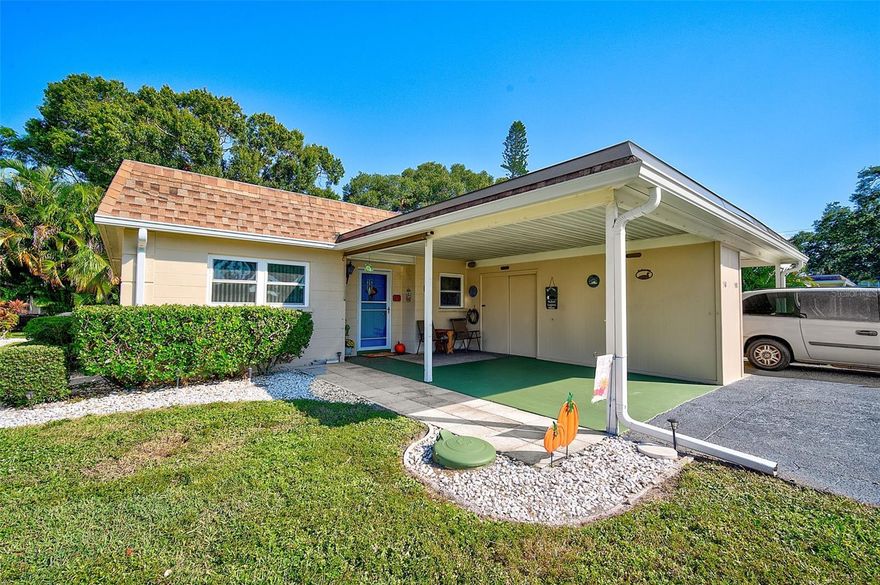 Meticulously maintained and nicely updated villa style condo available turnkey furnished!  Perfect for snowbirds or your new Florida home, this one story duplex style property lives like a single family home with the convenience of a condo.   The large covered carport on the front of the villa creates an outdoor living space and has an added storage closet for all of your tools and toys.  The extra long driveway allows for ample parking when entertaining.  The updated kitchen has been opened up with a doorway that connects the kitchen with the rest of the home.  Newer appliances, wood cabinets and a tray ceiling have been added to make the most of the space.  Easy care flooring throughout the home makes upkeep a breeze.  The large glassed in lanai on the back of the villa overlooks a private greenspace giving the utmost in privacy as you relax outside.  There is a full size washer and dryer and additional storage closet on the lanai.   A beautiful community pool and clubhouse completes the picture of this affordable and lovely Florida home.  Small pets are welcome!