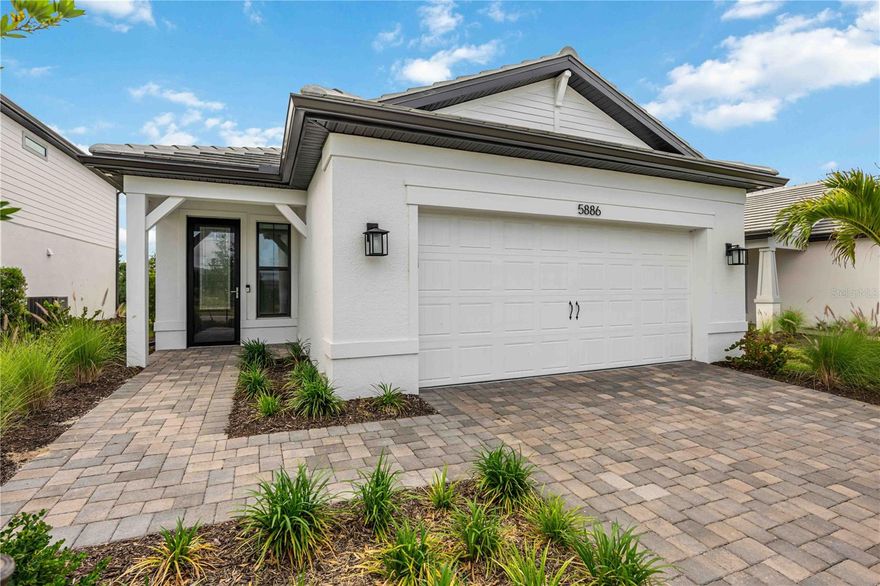 Welcome to the highly sought-after HALMARK model in the gated, resort style community of Talon Preserve on Palmer Ranch. Rare chance to own this immaculate home that has never been lived in with tons of upgrades. This beautifully crafted home blends modern design, functional living, and effortless Florida elegance…perfect for both seasonal and year-round enjoyment! 
Offering 1655 sq ft of thoughtfully designed living space, this home features 2 bedrooms, 2 baths plus a versatile flex room, ideal for a home office, guest overflow, or hobby space. The flex room could also easily be enclosed to create a 3rd bedroom, as it already has a closet.  The open concept floor plan creates a seamless flow between the kitchen, dining, and great room…making it perfect for entertaining or simply enjoying everyday living. The chef-inspired kitchen is the heart of the home and it is designed to impress with 42” cabinetry, soft-close doors & drawers, pull-out shelving, granite countertops, stylish tile backsplash, upgraded sink, and a full suite of appliances including a Gas Range. The spacious island overlooks the great room, where natural light flows in through the impact-resistant windows and sliding glass doors, leading to a screened-in-lanai, perfect for enjoying Florida’s indoor-outdoor lifestyle year round.  Step just outside your lanai and enjoy the peaceful setting of the natural preserve and the added privacy of having no one behind your home. Inside, you’ll find elevated finishes throughout, including 24" tile upgraded 8’ Cheyenne panel doors, enhanced bathrooms, and custom remote blinds installed across the entire home. Smart home features add convenience and modern functionality, while whole-house hurricane impact windows and doors, plus a whole-house gas generator, provide peace of mind. The primary suite offers a private retreat with a spacious layout and huge walk-in closet. The primary bath features a large, glass, walk-in shower with floor to ceiling tile. The split-bedroom floor plan ensures privacy for guests as well. This home truly stands apart with its extensive list of useful high-value upgrades including a tankless water heater, insulated garage door, and a mini-split system in the garage, perfect for climate control and added versatility. The garage itself has been expanded with a 4’ extension, finished with an epoxy-coated floor, and enhanced with attic storage & built-in stairs, offering easily accessible storage space and functionality that is rarely found at this level.
Located outside any immediate flood zones with low HOA fees, no CDD, and zoning for A-rated schools, this home delivers both value and peace of mind. Residents of Talon Preserve enjoy a resort-style heated pool with rock waterfall and splash pad, spa, full-service restaurant and bar, 18,000 sq. ft. clubhouse, state-of-the-art gym, arcade, pickleball, tennis and bocce ball courts, and a dog park for the four-legged residents. With direct access to the Legacy Trail and close proximity to Oscar Scherer State Park, pristine Gulf beaches, Sarasota Memorial Hospital, championship golf courses, and the vibrant downtowns of Sarasota and Venice, everything you love about Florida living is within easy reach. As you can see, with extensive upgrades, modern features, and a prime locatation, this HALLMARK model is truly move-in ready and offers a level of quality and convenience that is hard to match! Don't miss out on this rare opportunity & schedule your tour today!