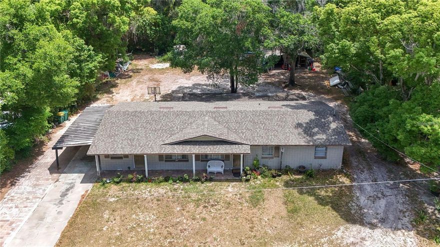 This spacious 3/2 is close to virtually everything Mount Dora has to offer.  Just up the street nearing completion is a brand-new Community Center.   A mere three blocks away is the Mt. Dora Community Pool (heated and open all year) and “Splash Pad”.  Just beyond the pool are tennis courts, multiple ball fields and a complete recreational complex.  Travel another 100 yards to the Dog Park.   Proceed a few more blocks down Unser St. and you’ll reach the renowned Ice House Sonntag Community Theatre known for top flight live entertainment.    Downtown Mt. Dora, a City of Festivals, with its wealth of outstanding restaurants and abundance of quaint little shops is less than a mile away.   The Lake Dora waterfront with all its opportunities for boating and wealth of water sports are literally at your doorstep!     The world famous Renninger’s Markets just a short hop across the Orange Blossom Trail.  This home with a NEW roof a year ago offers two very large bedrooms with a more modest third.   The home also features an oversized Great Room along with a dining room adjacent to a large kitchen which offers plenty of elbow room for the most enthusiastic of cooks.    The covered lanai provides a touch of the outdoors even when the Florida weather isn’t cooperating..  Lastly, an oversized shed in the very generous rear yard provides plenty of room for all those extras.   With the new SR 453 SPUR to the SR 429, Wekiva Parkway, just minutes away- downtown Orlando, Disney, Universal and the International Airports are all less than an hour away.    Come and enjoy the best Central Florida has to offer, come move  to Lake County and Mt. Dora.