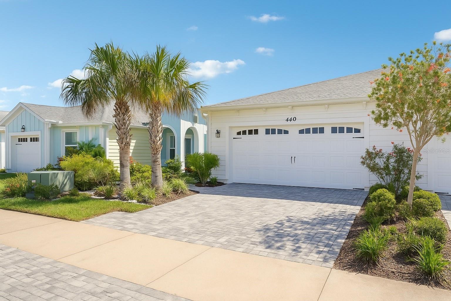 Enjoy the Florida lifestyle in this stunning 2-bedroom, 2-bath Antigua model with a den—featuring sliding glass doors that open all the way to your very own solar heated saltwater pool and peaceful pond views! Whether you're relaxing poolside or entertaining guests, this outdoor space is the ultimate retreat. Step inside to an open floor plan featuring several upgrades, crown molding and vinyl plank flooring throughout, plantation shutters, tankless hot water heater and a modern kitchen complete with 42'' wood cabinets, granite countertops and stainless steel appliances. The flexible den offers the perfect space for a home office, guest room, or reading nook. The primary suite has waterview, custom walk-in closet, and a double sink vanity with ample storage. Garage features durable Shark Coated floor-ideal for storage, hobbies, or a clean, polished look. Fantastic opportunity to join the most desirable 55+ community in the Greater NE Florida area! Enjoy music 7 days a week, private Bar and Chill Restaurant, private beach club with transportation, Mango Theater with unique events every month. State of the art Fins Up Fitness Center, Classroom with Pottery Workshop, Woodworking shop and Pet Spa. Pickleball Courts and Tennis Courts! The HOA fee includes a beautiful ocean front property with free transportation from the Town Center; active theater; bar & restaurant with weekly specials; expansive indoor & outdoor pools with live music; Additional live music in town center 3-4 evenings per week; busy monthly activity schedule; dog park. Don't miss your chance to own in Latitude Margaritaville! All information and measurements are deemed to be accurate but buyer must verify.