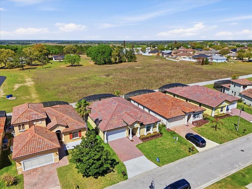 Brand-New Pool Home in Haines City. Where modern meets comfort! Beautifully designed 4-bedroom, 3 full bath + 1 pool bath home featuring an open-concept layout with modern finishes and abundant natural light. The gourmet kitchen offers quartz countertops, stainless steel appliances, contemporary cabinetry, and a spacious island.  Enjoy true Florida living with fully retractable sliding glass doors that disappear into the wall, seamlessly connecting the indoor space to the screened-in pool and covered lanai. Additional upgrades include an epoxy-coated garage floor, pending lights, elegant faucets, and high-end finishes throughout. Conveniently located near shopping, dining, major highways and Central Florida attractions, this property is ideal as a primary residence, vacation home, or investment opportunity.