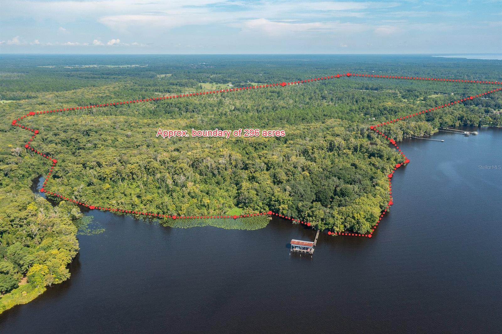 Under contract-accepting backup offers. WOW! ALMOST 300 ACRES WITH OVER 1000 FT ON THE BEAUTIFUL SAINT JOHNS RIVER AT ONE OF THE WIDEST POINTS. THE ASSEMBLEGE CONSISTS OF THREE OFFERINGS - OFFERING #1 IS 212.73 ACRES; OFFERING #2 IS 63.45 ACRES AND OFFERING #3 IS 20.6 ACRES. NOT ONLY IS THERE BEAUTIFUL RIVERFRONT, BUT THERE IS A TIDAL CANAL THAT RUNS DOWN PART OF THE PROPERTY THAT PROVIDES ANOTHER GREAT AMENITY. LARGE SECTIONS OF THE PROPERTY ARE CLEARED. THERE IS A TIMBER HARVESTING PERMIT ON THE PROPERTY WHICH KEEPS THE TAXES LOW. THE OWNER OF THE PROPERTY ALSO HAS A PACKAGE PLANT CERTIFICATE FOR WATER AND SEWER. THIS BEAUTIFUL OLD FLORIDA PROPERTY HAS MANY POSSIBILITIES - RIVERFRONT ESTATE OR YOUR OWN PRIVATE HUNTING CAMP OR A DEVELOPMENT FOR HUNDREDS OF HOMES. THE RIVERFRONT PROPERTY HAS AN EXISTING DOCK AND BOATHOUSE SITUATED AT THE MOUTH OF THE CANAL AND A WIDE PLACE ON THE RIVER. INCREDIBLE WATER VIEWS ON THIS WIDE SECTION OF THE ST JOHNS RIVER. THIS LOCATION HAS TREMENDOUS POTENTIAL. THE LOCATION IS APPROXIMATELY 10 MILES NORTH OF HISTORIC DOWNTOWN PALATKA AND ABOUT 18 MILES FROM GREEN COVE SPRINGS AND THE GROWTH AND DEVELOPMENT THAT WILL COME WITH THE NEW FIRST COAST EXPRESSWAY. A NEW WALMART IS A FEW MILES FROM THIS SITE AND THERE ARE OTHER BIG NAME STORES COMING TO THIS AREA. RARE OPPORTUNITY FOR A GRAND RIVERFRONT DEVELOPMENT.; Cleared: Partial