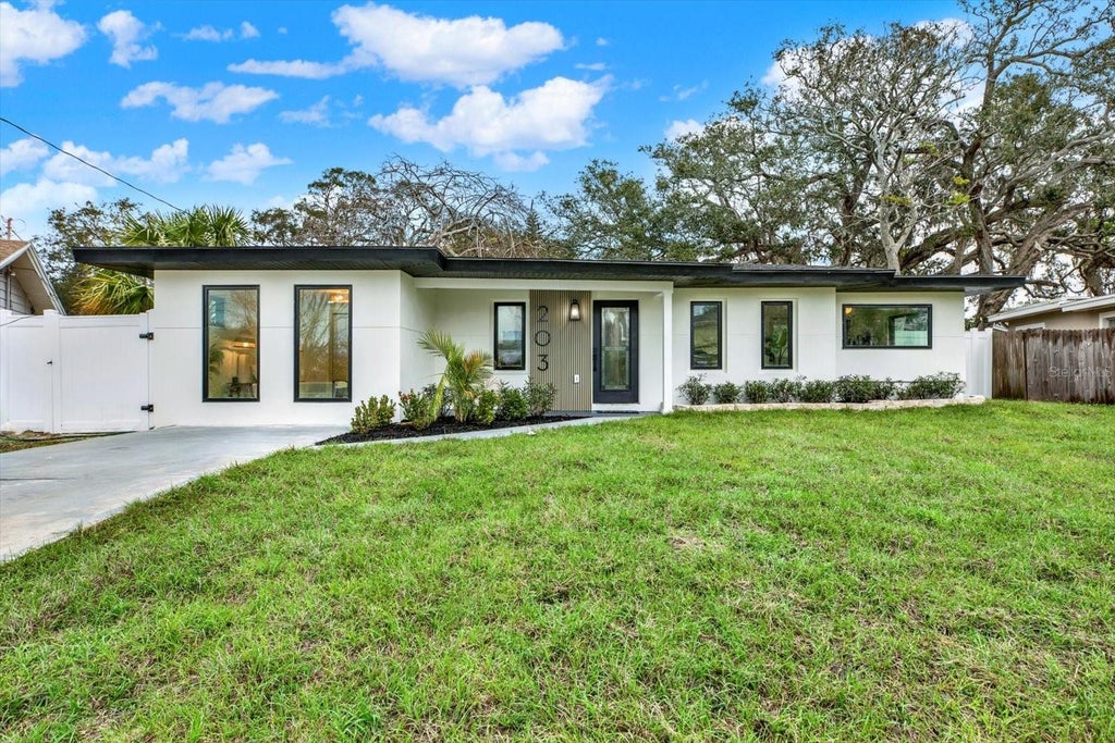 Photo of 203 Driftwood Drive W, Palm Harbor, FL 34683 (MLS # TB8523151)
