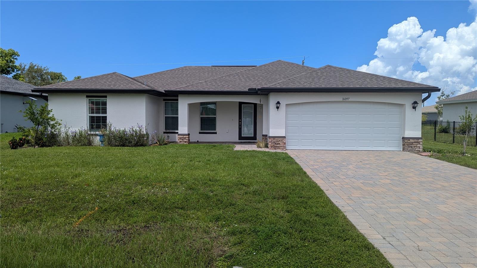 Welcome to Burnt Store Village! This beautiful home built in 2022 is ready for a new owner! This home consists of 3 bedrooms, 2 baths, a large open family room with volume ceilings open to the kitchen, perfect for large gatherings. The home has all tile floors throughout. The current owner has installed all mororized blinds in the main portion of the house and custom plantation shutters in the bedrooms. Outside you will find a huge screened in porch with pavers, great for entertaining. The current owner has installed a hurricane rated screen enclosure. Burnt Store Village is convenient to Punta Gorda and Fort Myers. Call today to schedule your tour of this great home!