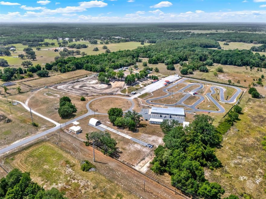 Unlock the potential of this rare commercial opportunity in Bushnell, FL! Situated just off Interstate 75 and CR 48, this expansive 20± acre property boasts high visibility and easy access—making it a strategic location for a wide range of business ventures. Currently operating as a Motorsports Complex, the property features a well-maintained large metal building on one parcel, offering flexible space and storage. There are multiple buildings on the 20 acres that can also be used for additional storage spaces. Ample parking. Whether you continue its motorsports legacy or reimagine it as an industrial park, event venue, or mixed-use development—the possibilities are endless.This is a rare chance to secure a large-scale property in one of Central Florida’s fastest-growing corridors. Don’t miss the opportunity to invest in a high-traffic, high-growth area with unmatched flexibility. Contact me today to schedule a private tour and explore the potential of this dynamic commercial property! DO NOT GO ON PROPERTY WITHOUT AN APPOINTMENT. N07A011 is being sold with N07A012.