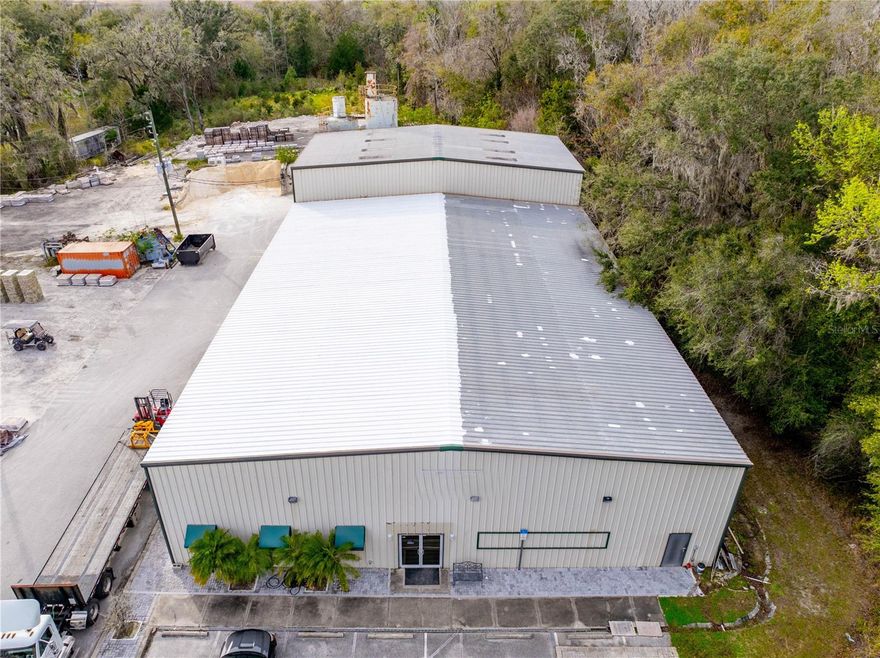 **Ask about Owner Financing** Welcome to an impressive industrial facility nestled in the heart of Hernando County, Florida. This expansive property spans a total of 11.1 acres, comprising two parcels of land strategically designed to accommodate a range of industrial needs. The front 5.4 acres are zoned PDP (HC) with C4 use, providing flexibility for various commercial applications, while the rear 5.7 acres are zoned AG, offering additional space for diverse industrial activities.

Dominating the landscape is a robust 12,000-square-foot metal building situated on the front parcel. This structure has been meticulously crafted to meet the demands of heavy industrial operations. The building features a spacious 1,088-square-foot air-conditioned office space, complete with a reception area, bathroom, and a kitchenette, ensuring a comfortable and functional workspace.

The foundation of the building boasts a heavy 8-inch concrete slab, specifically engineered to support heavy machinery and provide a stable platform for industrial processes. The strategic design includes three large bay doors, facilitating the seamless movement of heavy equipment in and out of the facility. These doors enhance operational efficiency and contribute to the overall functionality of the space.

Powering the facility is a robust 480V 3-phase power system, meeting the high-energy demands of industrial machinery and equipment. The property is secured with fencing on both sides, while the front entrance is equipped with fencing and a gated access point, ensuring controlled entry and heightened security.

In addition to its industrial prowess, the property is equipped with a well and septic system, providing essential utilities for day-to-day operations. The building itself reaches an impressive height of 20 to 30 feet, accommodating the needs of various industries and allowing for the efficient storage of large equipment or inventory.

Whether you are seeking a prime location for manufacturing, warehousing, or industrial operations, this property in Hernando County stands as a testament to versatility, functionality, and strategic planning in the realm of industrial real estate.