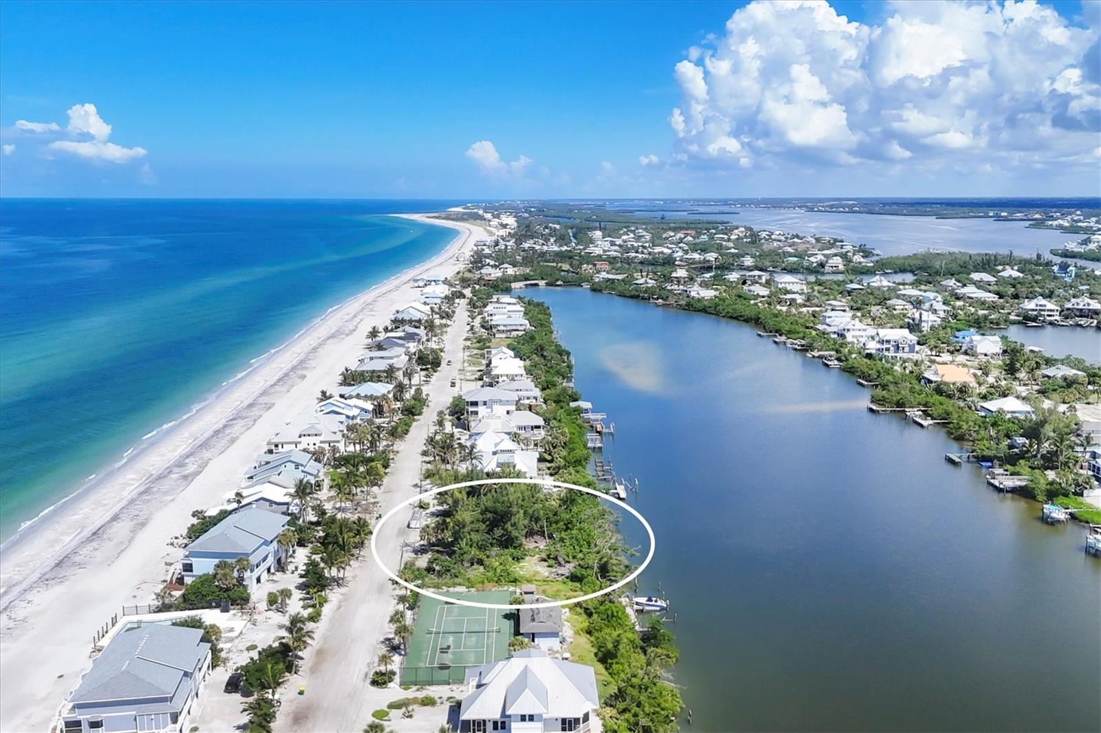 This vacant waterfront lot is located on Don Pedro/Palm Island. Just across a sandy lane to your deeded beach access.
This lot offers full water views of Bocilla Lagoon, approximately 350' across and possible partial views of the Gulf of Mexico. Plenty of room for a private dock with possible 2 lifts and a swimming pool. The adjacent lot to the north offering the same possibilities, is currently not listed for sale but seller may consider selling that parcel with the listed property. With both lots that will give you approximately ½ acre and the opportunity to build two homes with the potential to have a great family compound. The 2024 tax bill is based on 2 lots. The lots have been legally separated and the county has not established a new tax bill at this time, so the tax showing on the MLS was divided to give an approximate property tax amount. Buyer or Buyers agent should verify this amount.