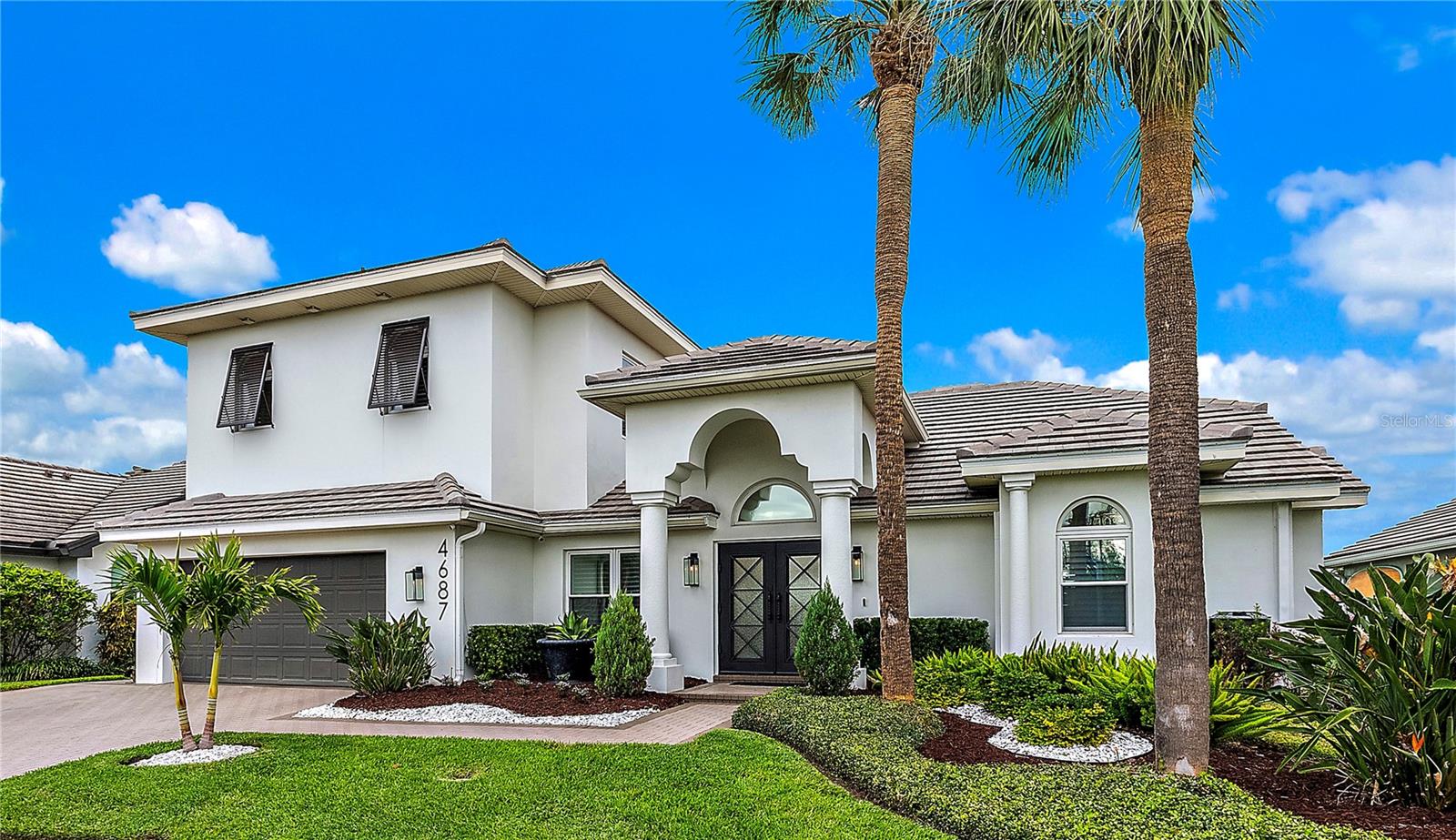 Thanks to this community's higher elevation and construction, all homes in Venetian Place withstood the record storms with no surge issues. Flood insurance for this stunning waterfront home is an incredible value at $1438/year currently. And it's an assumable policy.
This beautifully UPDATED home is located on a PRIVATE STREET and CUL-DE-SAC, with large dock, 10K pound boat lift, high ceilings, primary on main level, and only minutes from downtown St Petersburg! Ride your golf cart to the Vinoy Golf Club or Downtown St Pete! Many upgrades, including a brand-new ceramic tile roof in 2024. Location, Location, Location...and so much more.
With a spacious 3503 sqft feet, this coastal-modern home offers HIGH CEILINGS (uncommon in neighboring communities), 5 spacious bedrooms, PRIMARY ON MAIN, 4 1/2 updated bathrooms, CHEF'S KITCHEN with wine fridge and large walk-in pantry, IMPACT-RATED WINDOWS and SLIDERS throughout, and a LARGE BONUS ROOM with balcony overlooking the waterfront. NEW ROOF in 2024, plus MANY OTHER UPDATES in recent years. Simply move in and start living the waterfront lifestyle!
No expense has been spared in the last five years of upgrades. Home features a brand-new tile roof installed in 2024, complete with a 10-year transferable warranty. Every room showcases high-end finishes, from the kitchen to the bathrooms, ensuring you experience both style and functionality at every turn. Dock was replaced in 2020 and a tankless gas water heater was installed that same year.
Perfect for entertaining or relaxing in luxury, property includes a sparkling saltwater pool, outdoor alfresco dining area, covered patio, oversized master shower, and a layout that combines style and functionality. The chef's kitchen is designed with culinary enthusiasts in mind, featuring a gas cooktop, large walk-in pantry, and a dedicated coffee station that’s perfect for entertaining. While you’ll already have an abundance of space, upstairs you’ll find an additional, very large, storage area.
This private HOA neighborhood is perfect for those seeking a tropical Florida lifestyle! Around the corner from LCC School, and only a few minutes from Publix, Whole Foods, shopping, and so much more.
Contact us today to schedule a private showing and experience the lifestyle this home has to offer!