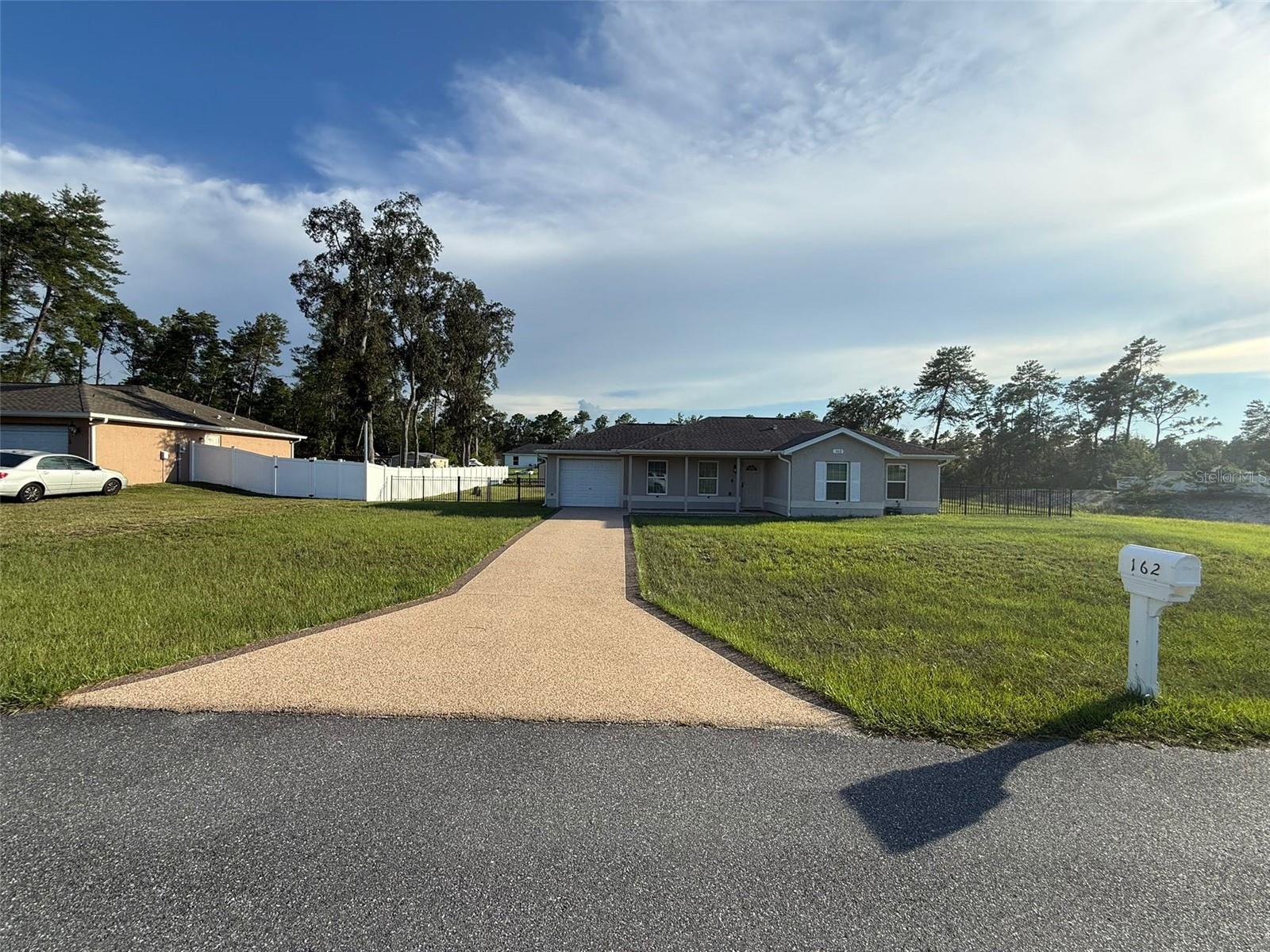 Enjoy paradise year-round in this pool house for rent in Ocala, Florida. This unique property sits on a nearly half-acre, fully fenced lot, offering privacy, space, and convenience in a quiet Marion Oaks neighborhood, close to shopping, schools, and quick access to major thoroughfares. Featuring 3 bedrooms, 2 bathrooms, and a garage, this home is equipped with tile flooring throughout, a kitchen with granite countertops, an in-home laundry area for added convenience, and a spectacular outdoor space with a screened-in pool, outdoor kitchen, and barbecue grill perfect for enjoying summers with family, parties, and much more. Ideal for those who desire style, comfort, and space. Available for rent on an annual lease. Available now. Don't miss this opportunity.