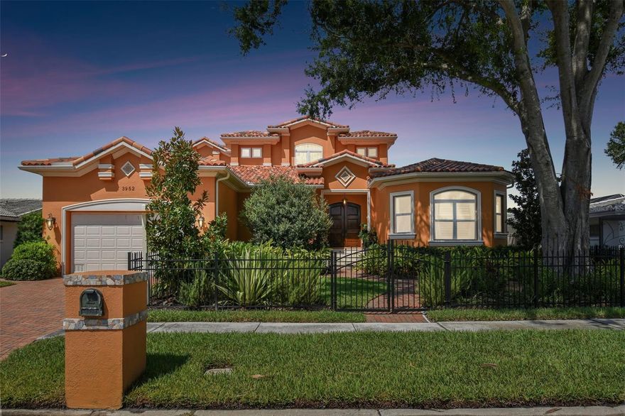 WATERFRONT 5 bedroom, three full bath 2005 year built home in Dana Shores, on beautiful sailboat water, wide saltwater canal with gorgeous sunset views! Appointed with thoughtful details throughout the home, from the gorgeous custom arched doors to the newer impact windows, from the crown molding to the double-sided gas fireplace, from the 280+ bottle custom wine cellar to the gazebo, surround sound speaker system, and outdoor kitchen. Chef's kitchen (custom wood cabinetry; SS appliances- Thermador gas cooktop with hood, Wolf wall oven, 2 Fisher & Paykel Dishwasher drawers, brand new Samsung French door refrigerator) with sunny wall-to-ceiling windows in breakfast nook; majestic owners’ suite with generous walk-in closet, wisely placed adjacent to laundry room; and finally a lovely first-floor guest bedroom and full bath. Upstairs has three large bedrooms and one full bath with double vanity and separate water closet/shower (Jack and Jill set up between bedrooms 3/4). Currently, bedroom 4 (with wood floors) is an office and flex space. The front bedroom (#5/bonus room) is 12x24 and has plenty of room for the full fourth bath to be installed (already plumbed) if desired. Outdoors, one will enjoy a tropical, low-maintenance backyard with Trex Deck, Gazebo with tile roof, outdoor kitchen, gas grill, and dining space… all while waiting for the dolphin and manatee to come by at any time of the day! Marvel at the sunsets from your home, or hop on your boat from your boat lift/dock to head out for floating sunsets in the Bay!