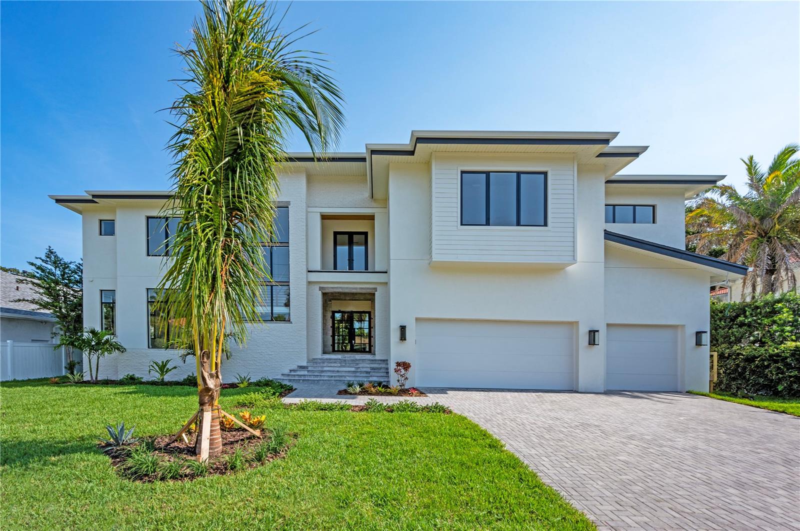 Under contract-accepting backup offers. This gorgeous home is now ready for it's new owner. This near 6,000 square foot Modern Farmhouse pool home is an absolute showstopper. Like nothing you've seen before, Forge Builders along with custom designers have taken this luxury home to the next level. This masterpiece has a stunning exterior which exudes presence in the aesthetics and robust features such as clopay modern steel garage doors and a smooth "sand finish" stucco exterior. Upon the striking entry, discover a great room with oversized custom hurricane impact windows that bring natural light to a new dimension connecting home and outdoors, the openness of the space transcends you to an place of style and serenity, In the kitchen, custom transitional cabinetry showcasing high end hardware are the perfect complement to the quartz countertops and the elite luxury Gaggenau appliance package ready for any chef to prepare a delicious meal or to enjoy a glass of wine. The smooth drywall sets the stage for your eyes to soak in every detail of this one-of-a-kind high-end home. With an oversized guest suite on the first level, you and your guests will appreciate a private haven for them to feel like they are in a boutique hotel. In the spacious primary suite, upstairs you can unwind overlooking your outdoor oasis before heading to your magazine ready bathroom that has a freestanding soaking tub and rain shower to enjoy after a long day. The primary room also connects to your laundry room for smart living. The remaining bedrooms are upstairs to give this spacious home a total of 5 bedrooms and 5 bathrooms with 2 half baths. The expansive media and bonus room has a wet bar with wine refrigerator to host any big game watching party or movie screens with your friends and family. There is another room you could transform into a private home gym or make it your home office; the options are endless. The 3-car garage with epoxy-coated floors has ample space to park your cars or showcase them and has entry into the house with a landing area for function and organization that creates a breath of calm once home. This home is made for entertaining with a salt water custom pool and covered outdoor kitchen off the great room to allow for conversation and sun soaking. The location is superb in South Tampa's popular Sunset Park on the much-loved Swann Avenue, just steps from the beauty of Swann Circle and conveniently near A+ rated schools and minutes away to all of Tampa's top restaurants, local eateries, Tampa International Airport, and the best shopping.