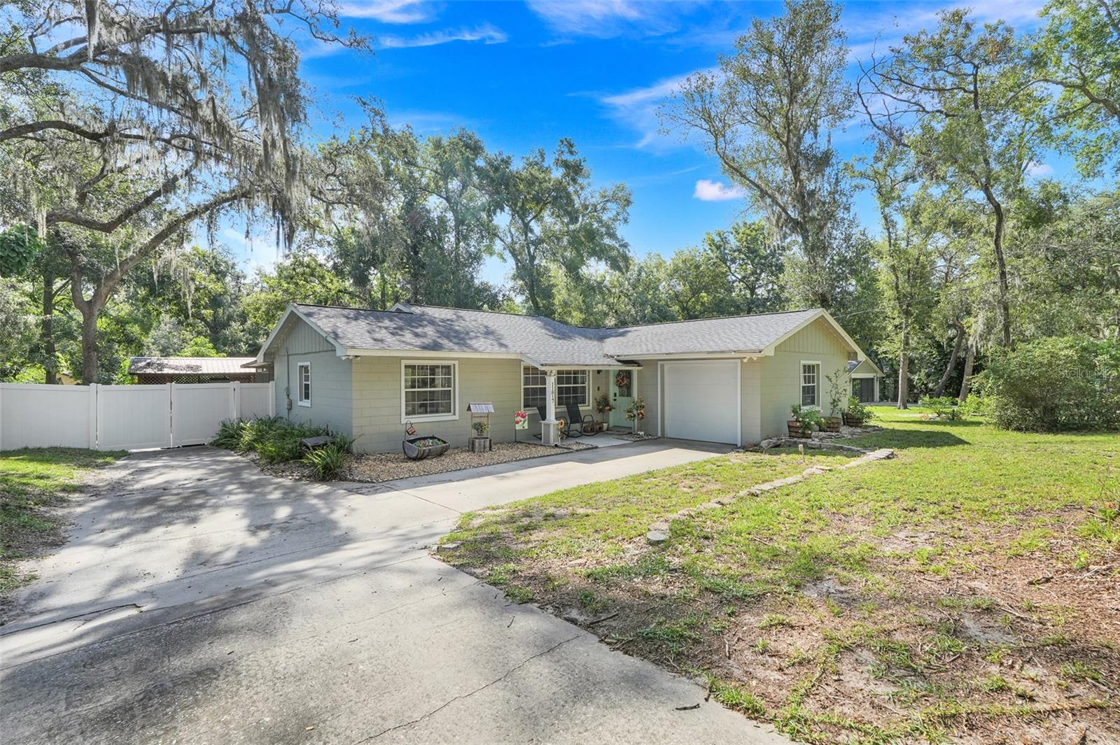Welcome to this beautiful ranch-style home offering 3 bedrooms and 2 full bathrooms, perfectly
designed for comfortable single-level living. Step inside to an inviting layout with plenty of natural light,
making every space feel warm and welcoming. There is ceramic tile throughout the living areas and
bathrooms and bamboo wood floors in the bedrooms. The well-appointed kitchen flows seamlessly into
the dining and main living areas, creating the ideal setting for both everyday living and entertaining. It
has beautiful granite countertops and stainless steel appliances. The interior and exterior of the home
were painted in 2019, a NEW ROOF installed in 2020, a new vinyl fence in 2021 with 2 8’ double gates
to make it easy to park your boat or RV, a new storage shed, a new water heater and a new breaker box.
Enjoy Florida living at its finest on the spacious screened-in back porch—perfect for morning coffee or
enjoy the evenings sitting on the new deck overlooking a private, vinyl-fenced backyard— perfect for
pets, play, or gatherings. This property also offers access to Lake Louisa, part of the highly desirable
Clermont Chain of Lakes, where you can enjoy boating, fishing, and endless water recreation right in
your own community. With its thoughtful layout, private outdoor spaces, and access to one of Central
Florida’s most sought-after lake chains, this home truly has it all. Don’t miss the opportunity to make it
yours!