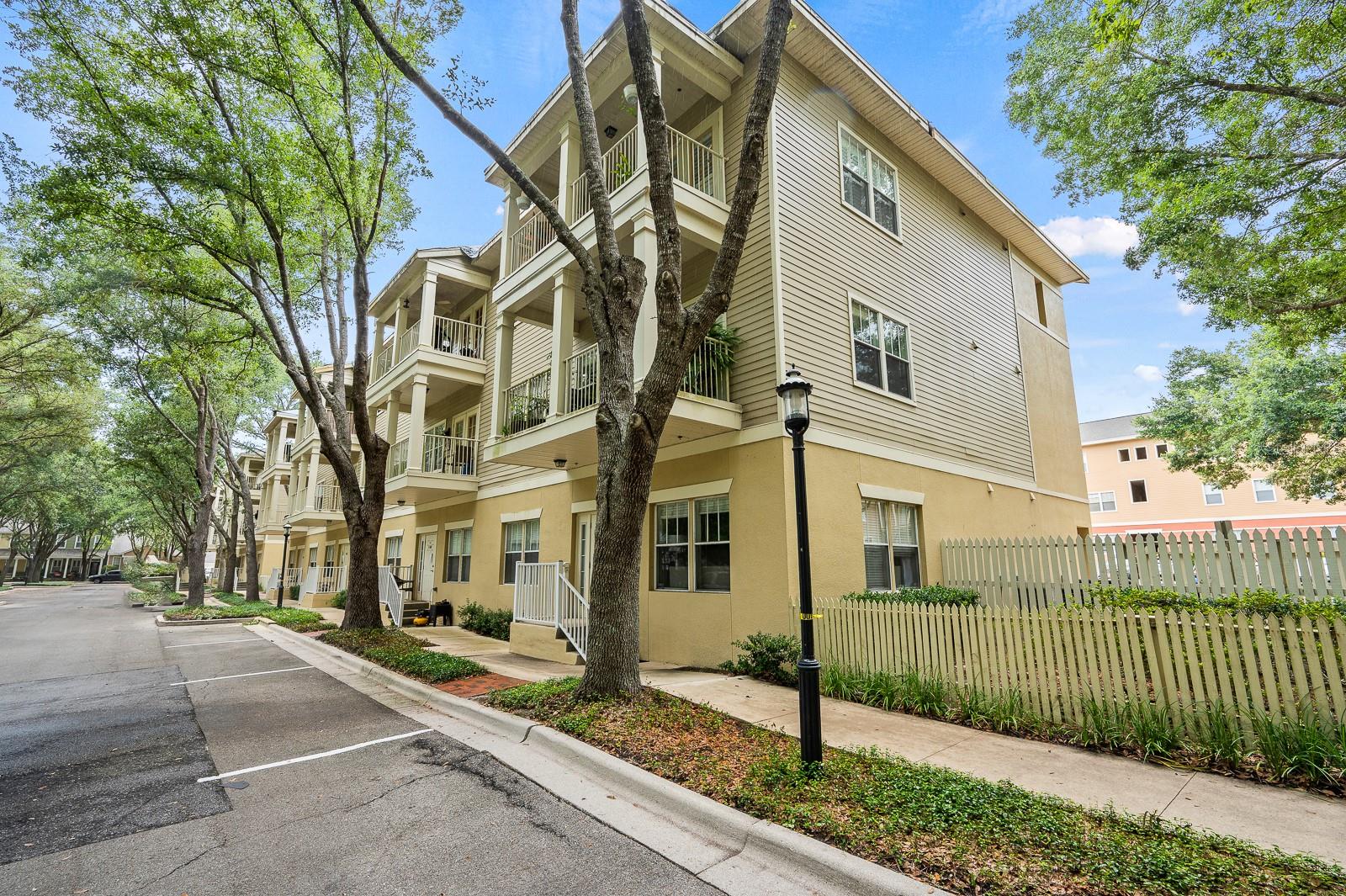 Welcome to this beautifully updated 3-bedroom, 3-bath condo, ideally located in the heart of the highly sought-after Haile Plantation Village Center! This second-floor gem combines charm and convenience, with a new roof, new flooring, a brand-new HVAC system, and a kitchen featuring spacious granite countertops, newer stainless steel appliances, and classic white cabinetry. The inviting living room is highlighted by a cozy fireplace, making it the perfect place to relax. Designed with privacy in mind, the split floor plan offers three generously sized bedrooms, each with walk-in closets. Additional highlights include indoor laundry, a separate storage room, and a French door that leads to a spacious balcony, perfect for outdoor dining or simply enjoying the serene view of lush greenery, mature trees, and the community pool and fitness center. For those with an active lifestyle, take advantage of nearby jogging trails, or if you’re a golf enthusiast, you’re just steps away from Hawkstone Golf and Country Club. Haile Plantation Village Center is right at your doorstep, with a variety of restaurants, shops, and a weekly farmer’s market—all just across the parking lot! You’ll also enjoy exclusive access to the community pool, playground, and fitness center. This condo is ideally located just minutes from UF, UF Health/Shands, HCA North Florida Hospital, the VA Hospital, Celebration Pointe, Butler Plaza, and more, making it perfect for both work and play!