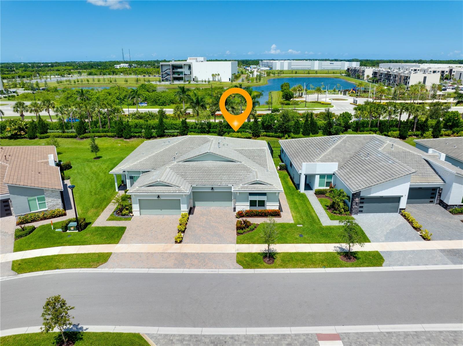 One or more photo(s) has been virtually staged. Stunning move-in-ready villa in the gated community of Telaro at Southern Grove in the heart of Tradition. Everyday will feel like a vacation living in this newer construction home with access to the resort style amenities right at your fingertips. This home features 2 Bedrooms, 2.5 Bathrooms and a Den. This well appointed villa features wood-look tile flooring throughout the main living areas. Large kitchen with gas range, long quartz countertops, a center island with room for barstools and a spacious walk-in pantry. The open concept living and dining area offer flexibility to fit an oversized sectional and large dining table. Natural light shines throughout and all windows feature convenient zebra blinds. Impact windows throughout. Screened patio with private backyard and lush landscaping. Room for a small pool and the community allows a fence. Primary bedroom is spacious and can fit a king sized bed with nightstands on both sides. Large primary bathroom features quartz counters, double sinks and a large walk in shower. Convenient walkthrough from primary closet straight through to laundry room. Split bedroom floor plan with a guest bedroom in the front of the home. Second full bathroom with custom tub-to-ceiling tile. Unique design features throughout the home including wood accent wall near entrance, custom wallpaper in half bathroom and built in shelving near garage entry. Impact windows and CBS construction lend peace of mind to this move-in-ready home. Two car garage with a paver driveway allows room for multiple cars. Telaro just completed a magnificent 20,000 square foot clubhouse. Inside you have access to a grand hall, lounge area, demonstration kitchen, card room, wine room, craft room, grab and go cafe, saunas and massage room. Outside you will find plenty of shaded seating areas, resort style pools, a zen garden, basketball, bocce ball, pickelball, and tennis courts. Vibrant community with a robust calendar of events including wine club, cooking club, poker club, tennis club, book club, yoga club and more. Come experience a resort lifestyle. Located right near the Heart at the Park, the latest Port Saint Lucie attraction and restaurants like Kyle G’s Chophouse, Sara’s Kitchen, Robeks Juice. Minutes from The Fresh Market, Target, Publix and shopping at the Landing at Tradition. Tradition town center is home to a Sunday farmer’s market and a variety of community events. Conveniently located near I-95 and easily accesible to Palm Beach International Airport.